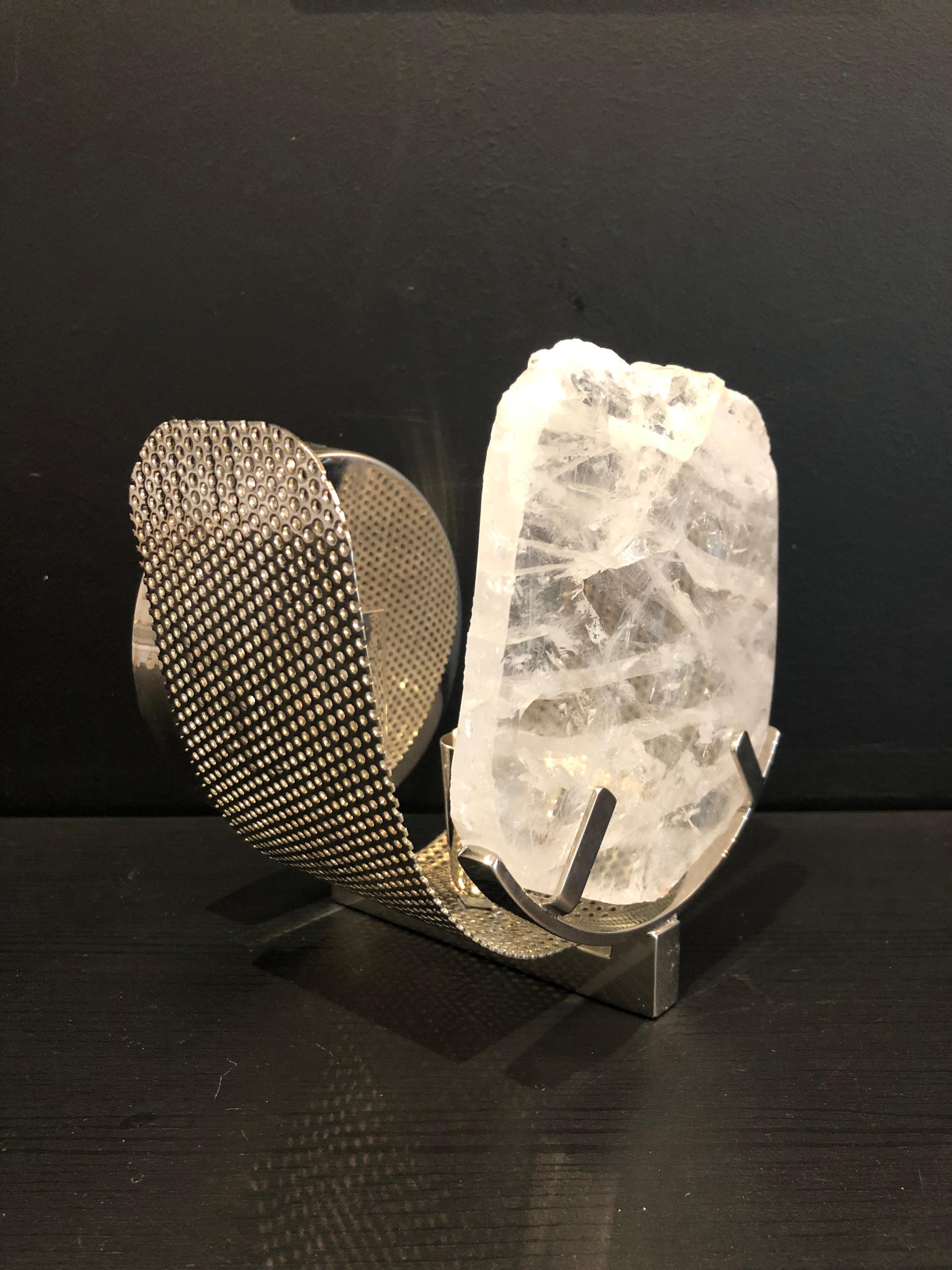 Beautiful wall light sconce - unique piece made with blade crystal rock and nickled brass structure.

The process of creation goes through several craftsmen before reaching the final stage, and each craftsman is specialized in one single material