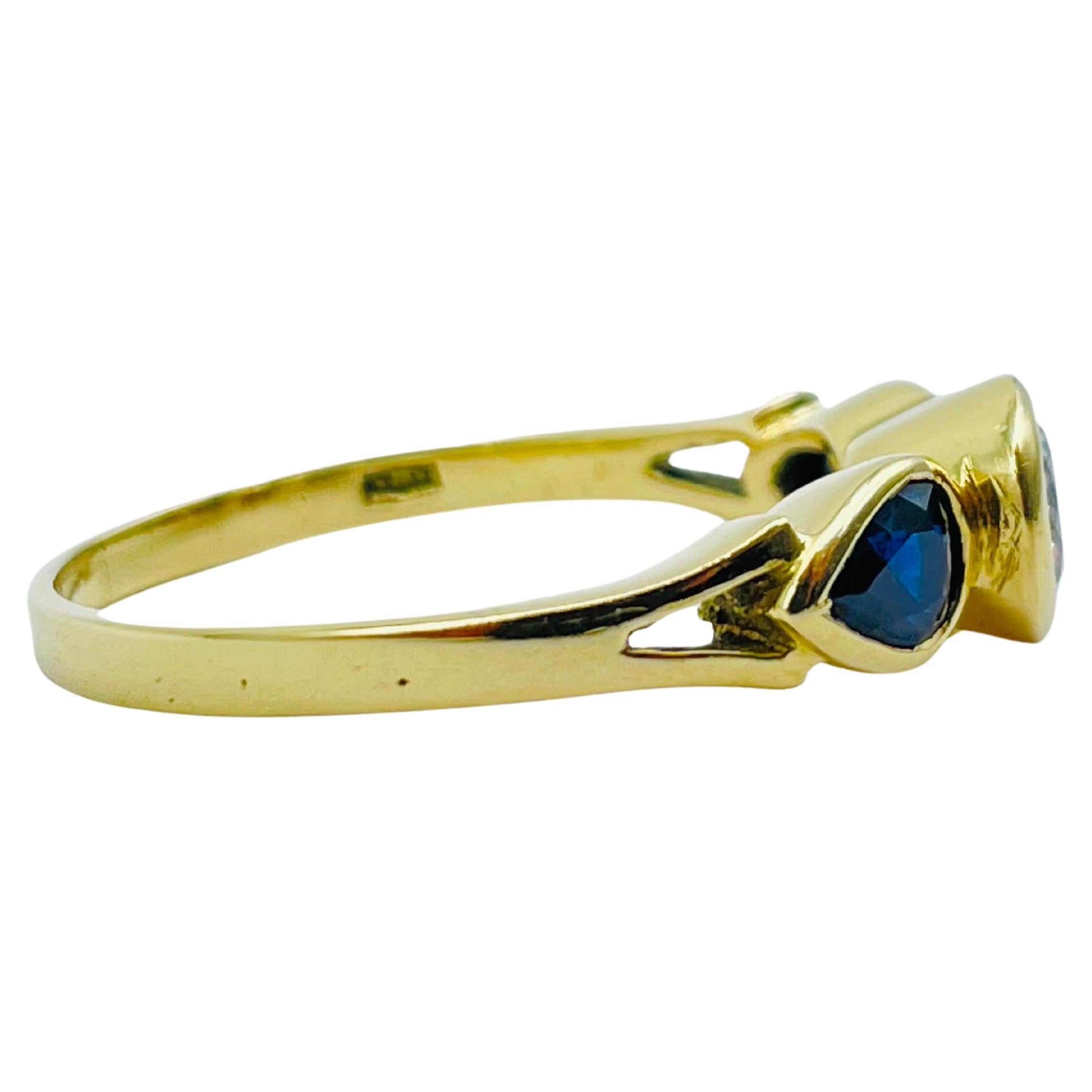 Brilliant Cut Beautiful yellow gold ring 0.60carat diamond, 2 blue sapphire teardrops For Sale