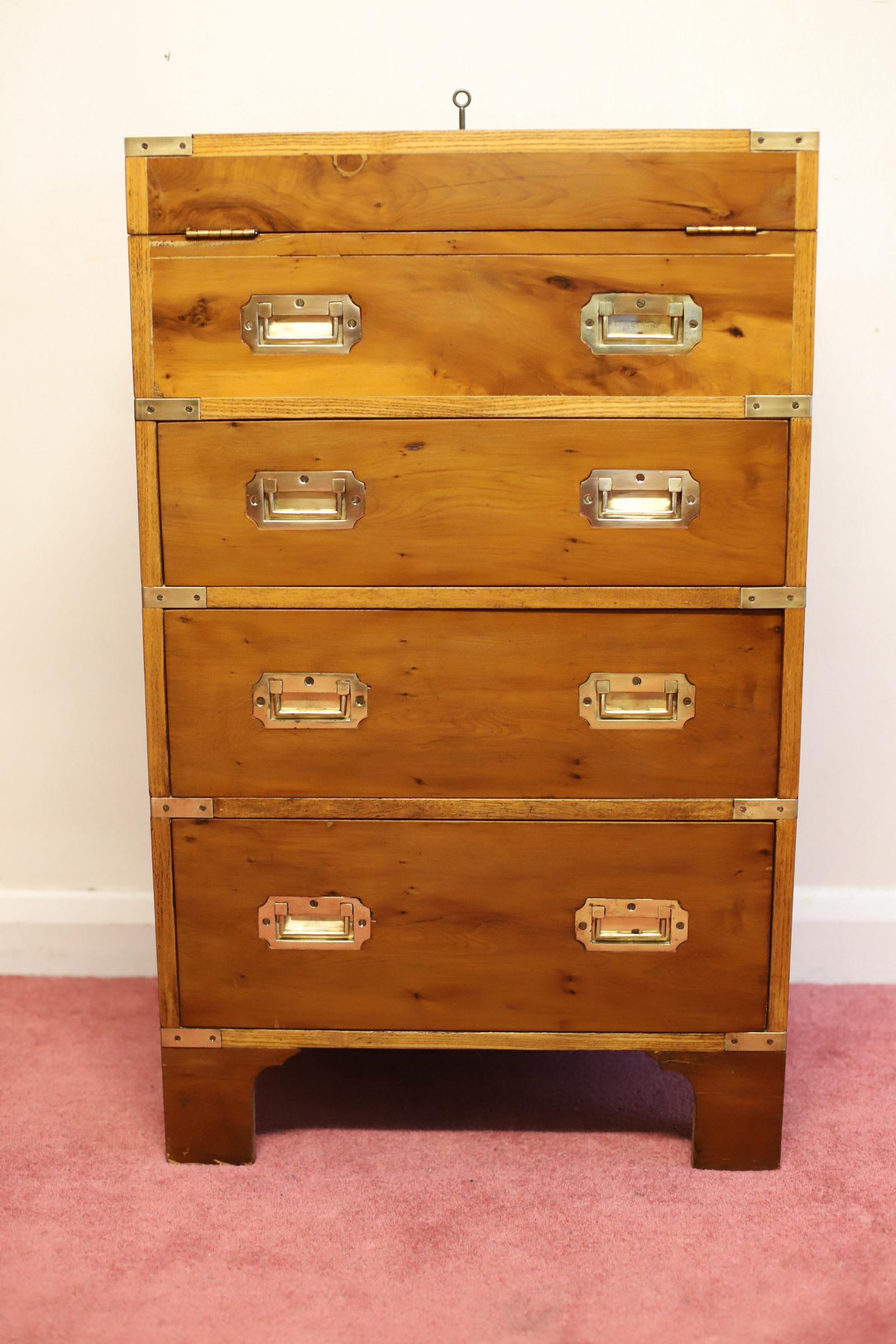 We delight to offer for sale this amazing military secretary campaign chest with three large drawers and brass corners with brass insert handles and one faux drawer , however the top it open and offer a hidden writing table with leather insert and