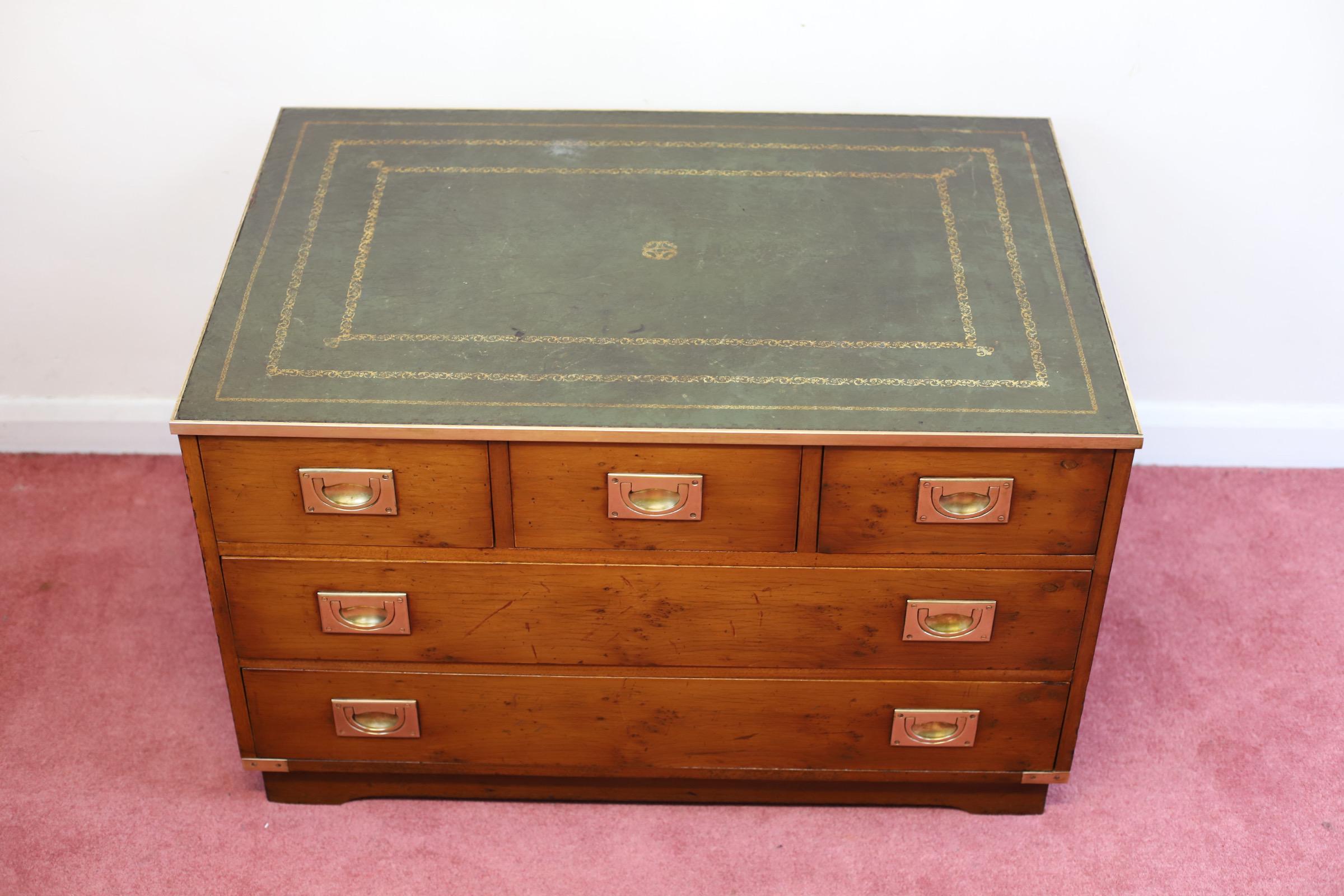Bevan Funnell 'Reprodux' yew campaign style chest of five drawers, the brass mounted top inset with green leather . 
Don't hesitate to contact me if you have any questions.
Please have a closer look at the pictures because they form part of the