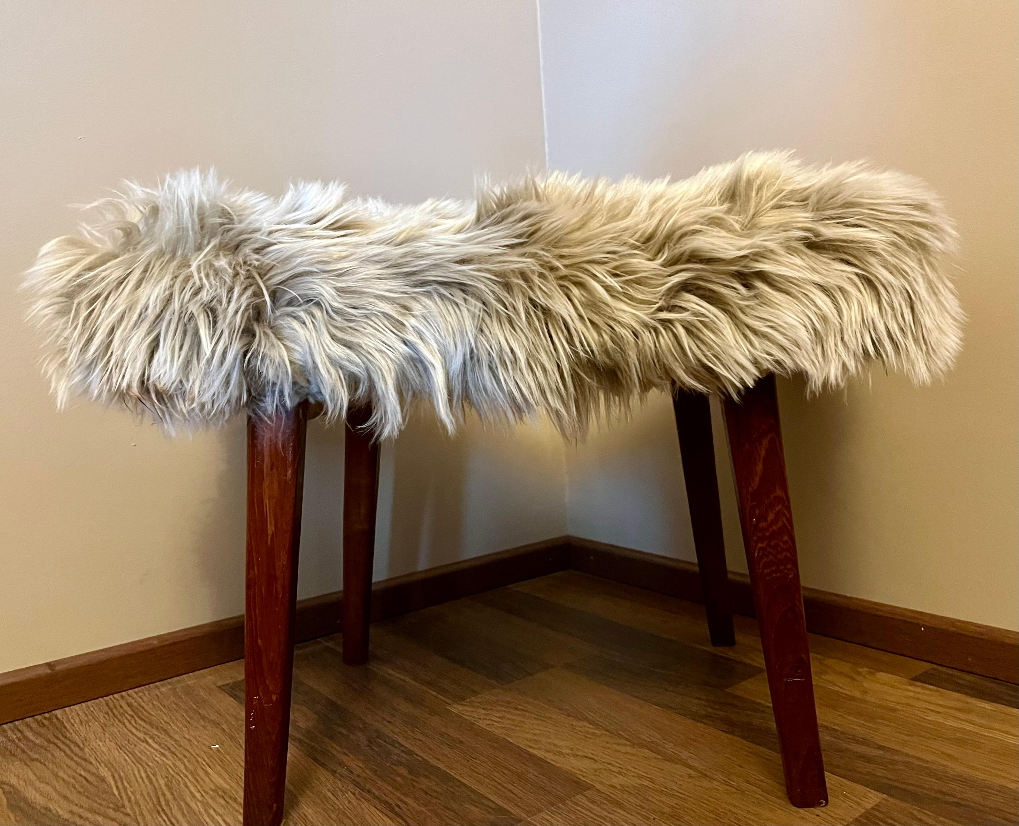 **Vintage Finnish Handmade Stool/Chair with Teak Legs – A Unique Interior Gem!**  

This exquisite handcrafted Finnish stool/chair is a rare find. Featuring sturdy teak legs and an elegant **genuine sheepskin upholstery**, it offers both warmth and
