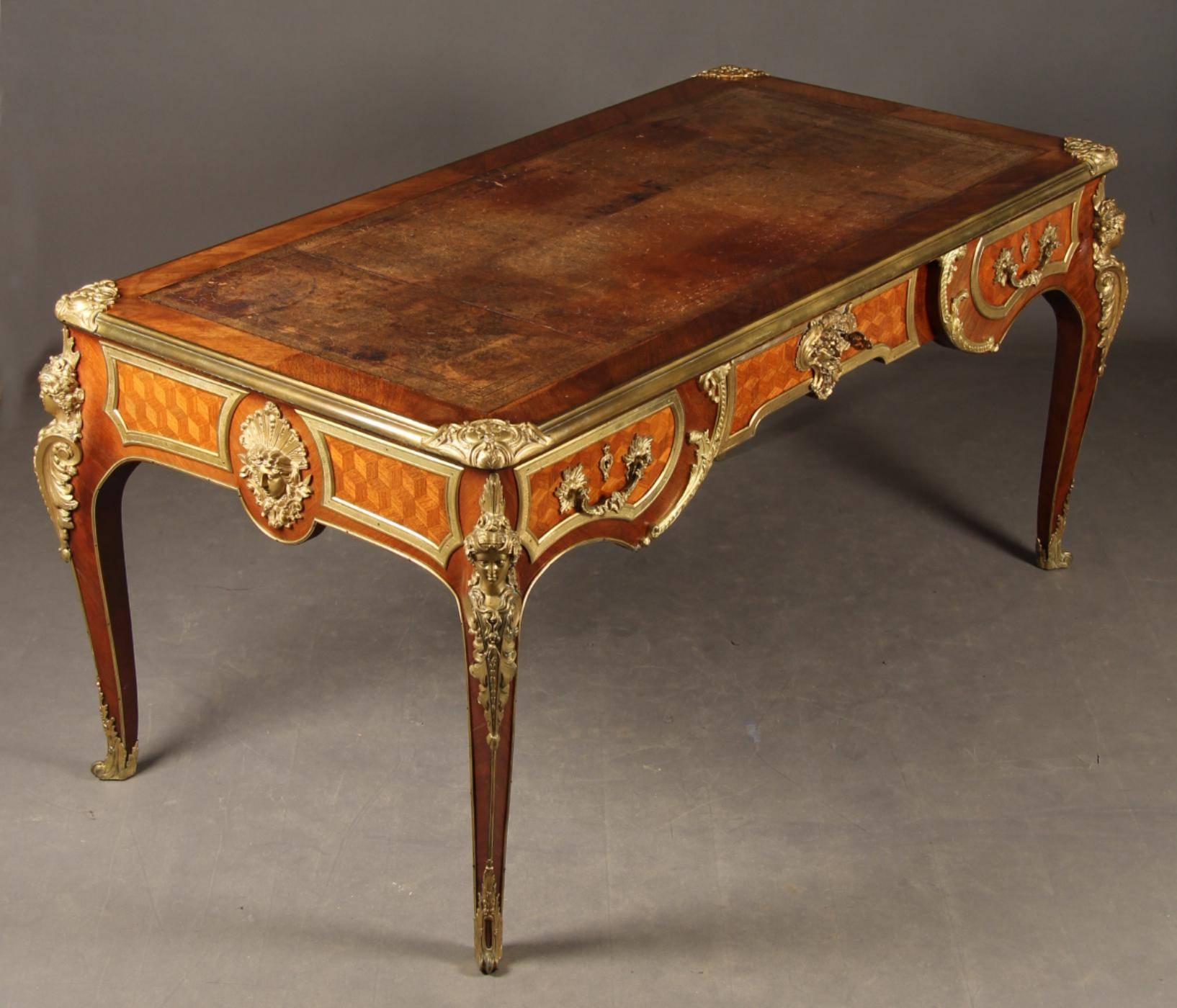 An important and beautiful France, 19th century, Louis XV style
Kingwood and ormolu Bureau plat, the desk is raised on elegant
cabriole legs richly chased ormolu mounts. Gilt tooled leather
writing surface.