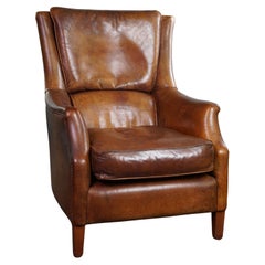 Beautifully aged sheep leather armchair with stunning colors, comfortable seat