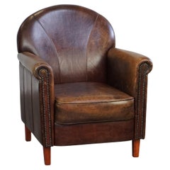 Beautifully and properly finished designer armchair made of sheepskin leather
