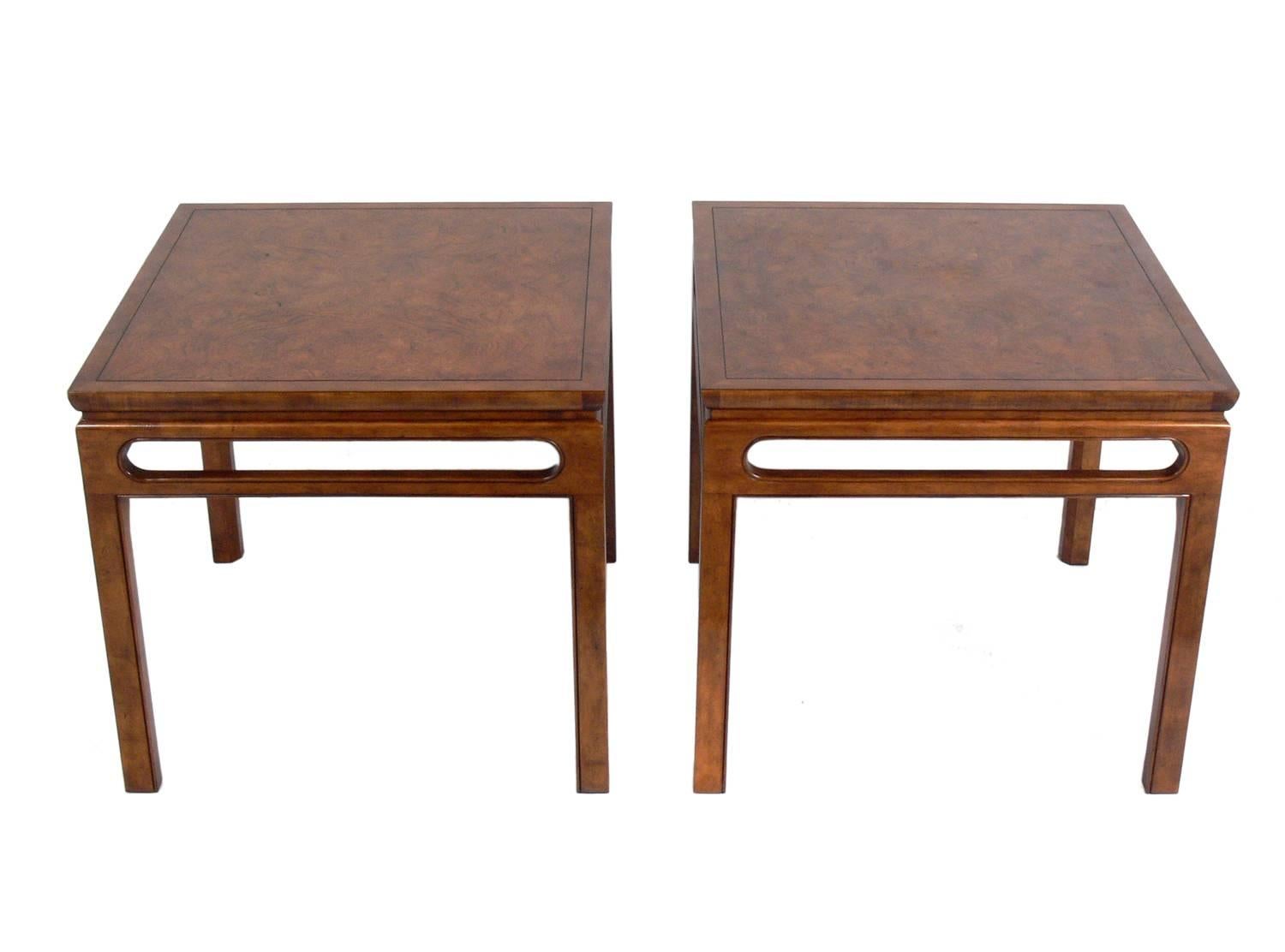 Beautifully burled wood end tables by Baker, American, circa 1960s. They are a versatile size and can be used as side or end tables, or as nightstands. They retain the manufacturer's labels underneath.