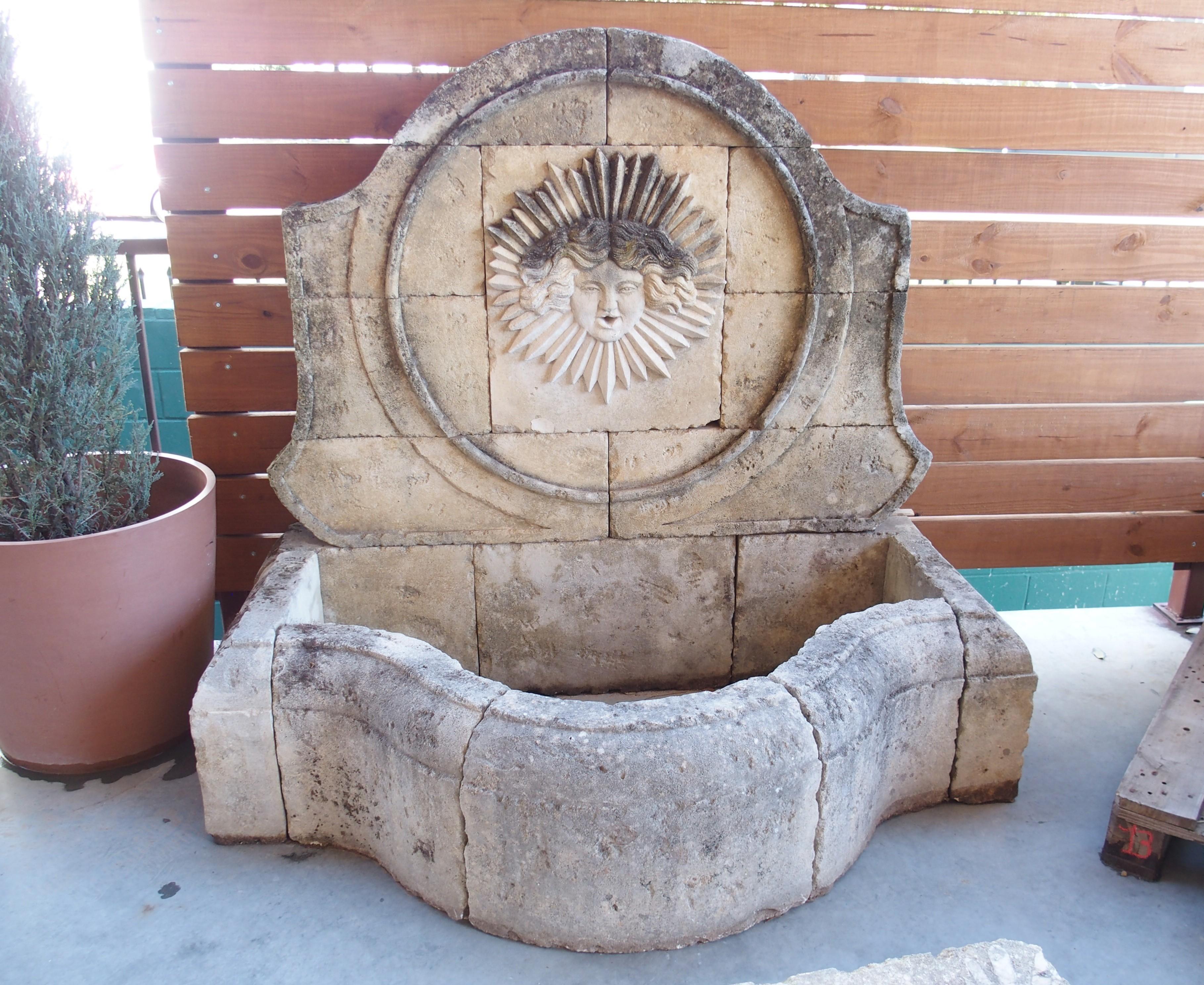 Hand-Carved Beautifully Carved French Sunburst Wall Fountain in Aged Limestone For Sale