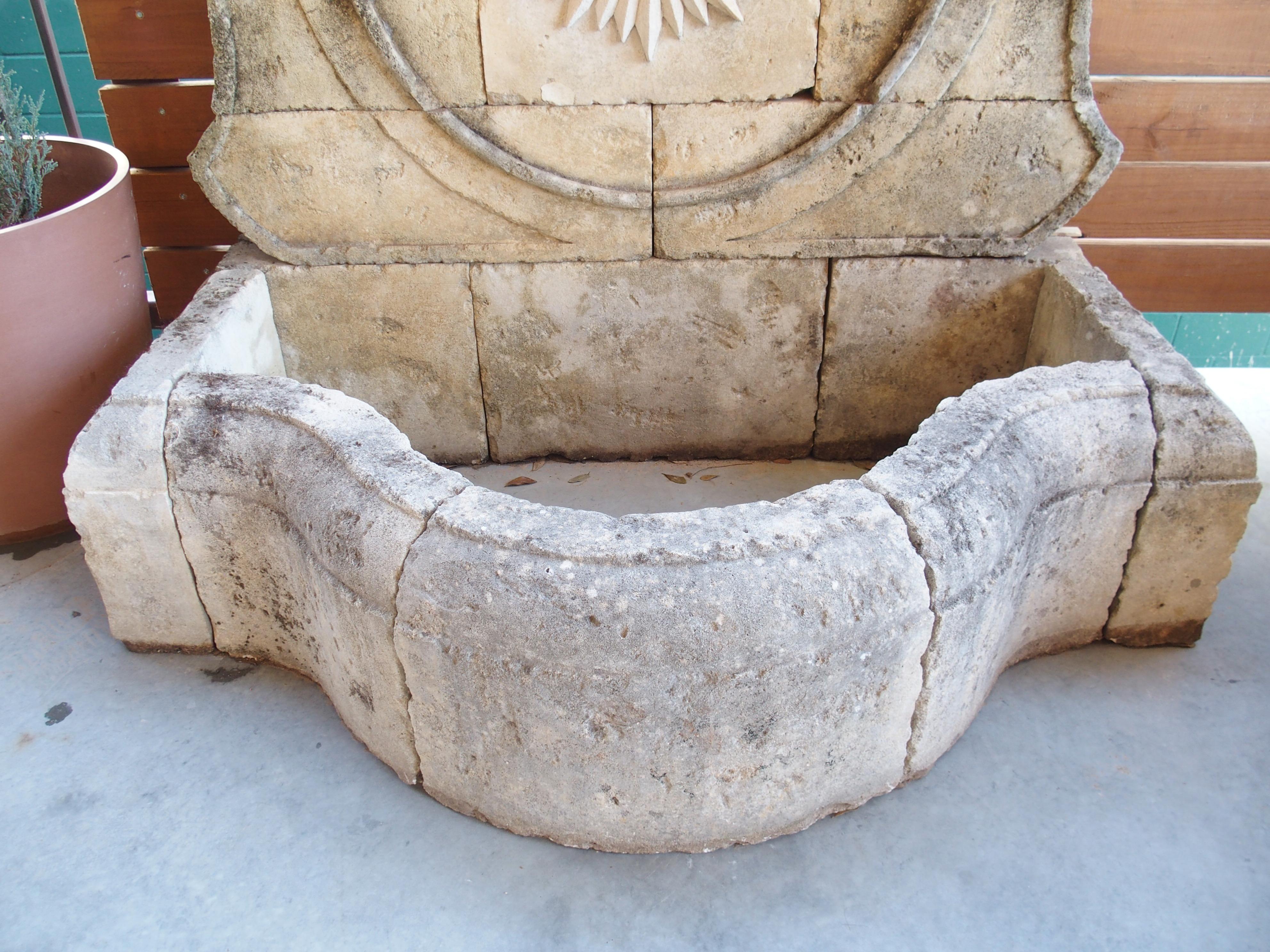 Contemporary Beautifully Carved French Sunburst Wall Fountain in Aged Limestone For Sale