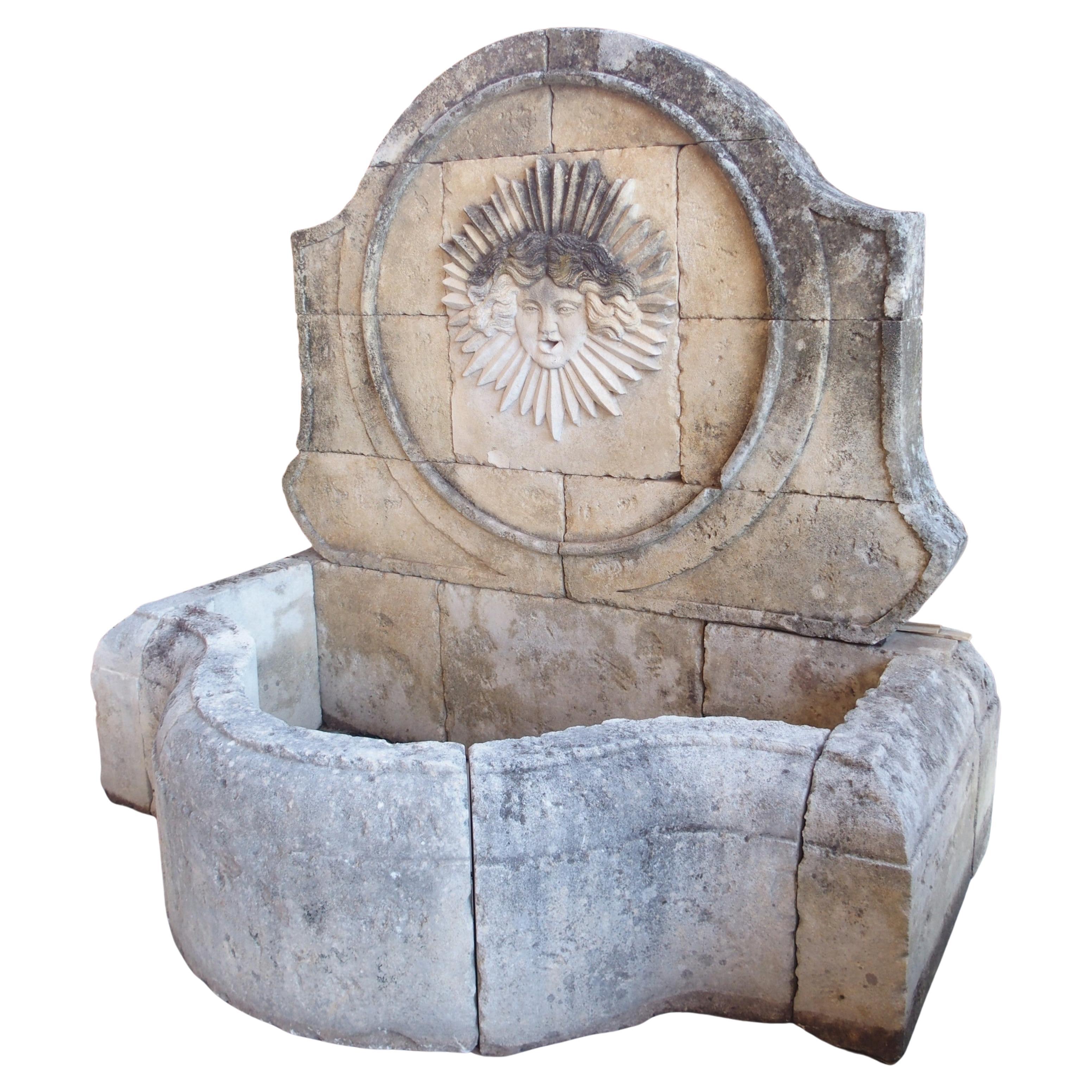 Beautifully Carved French Sunburst Wall Fountain in Aged Limestone For Sale