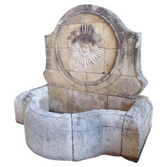 Beautifully Carved French Sunburst Wall Fountain in Aged Limestone