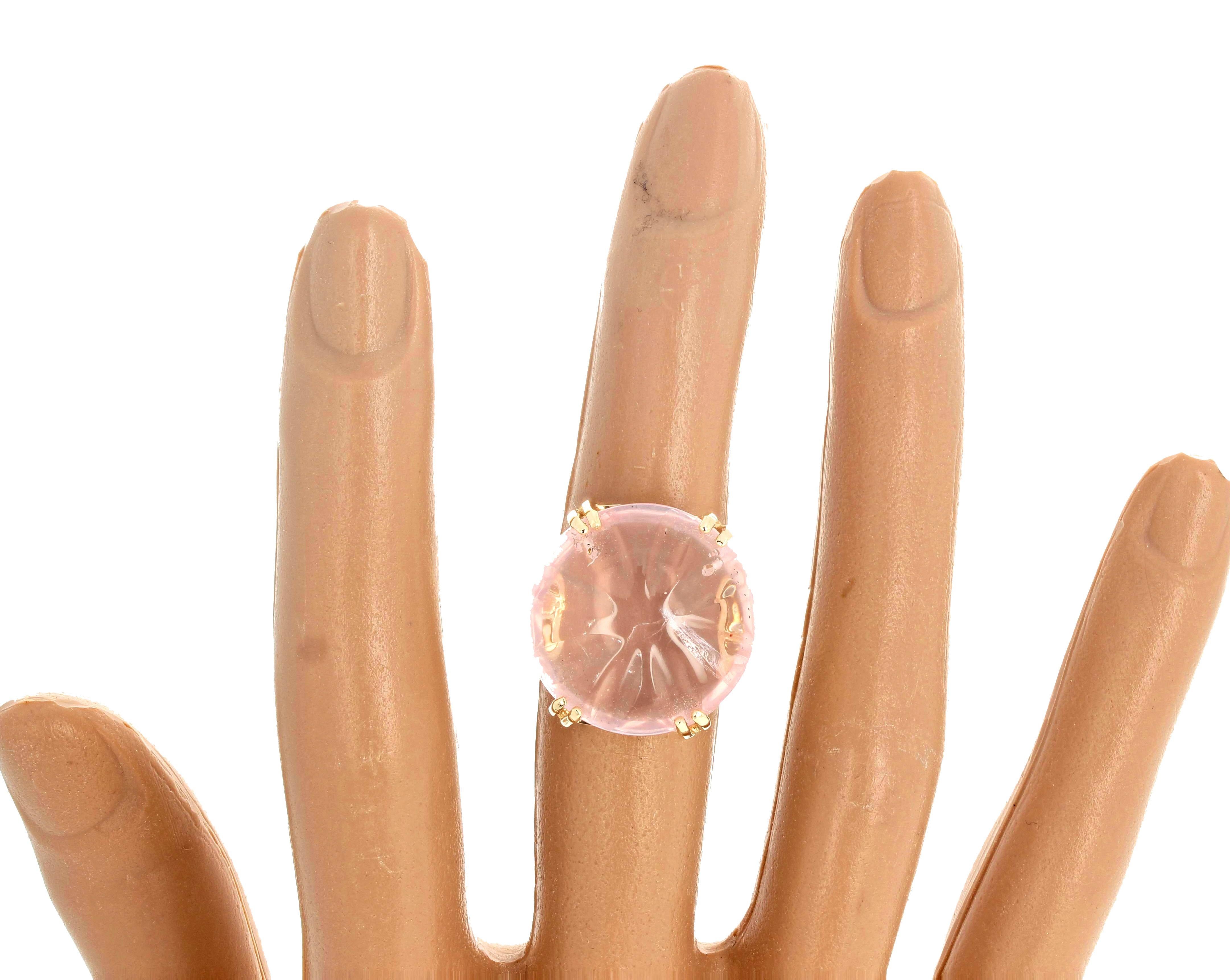 Gorgeous highly polished smoothly carved Rose Quartz - approximatley 14 carats - 20 mm wide - set in this beautiful 10Kt yellow gold ring size 7 (sizable).  This is fascinating to look at because of the rare unusual carved polished surface.  