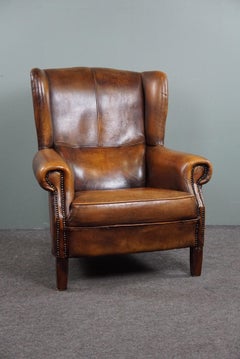 Beautifully colored and comfortable sheepskin leather wing chair