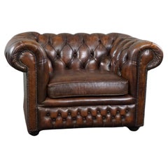 Beautifully colored spacious Chesterfield armchair