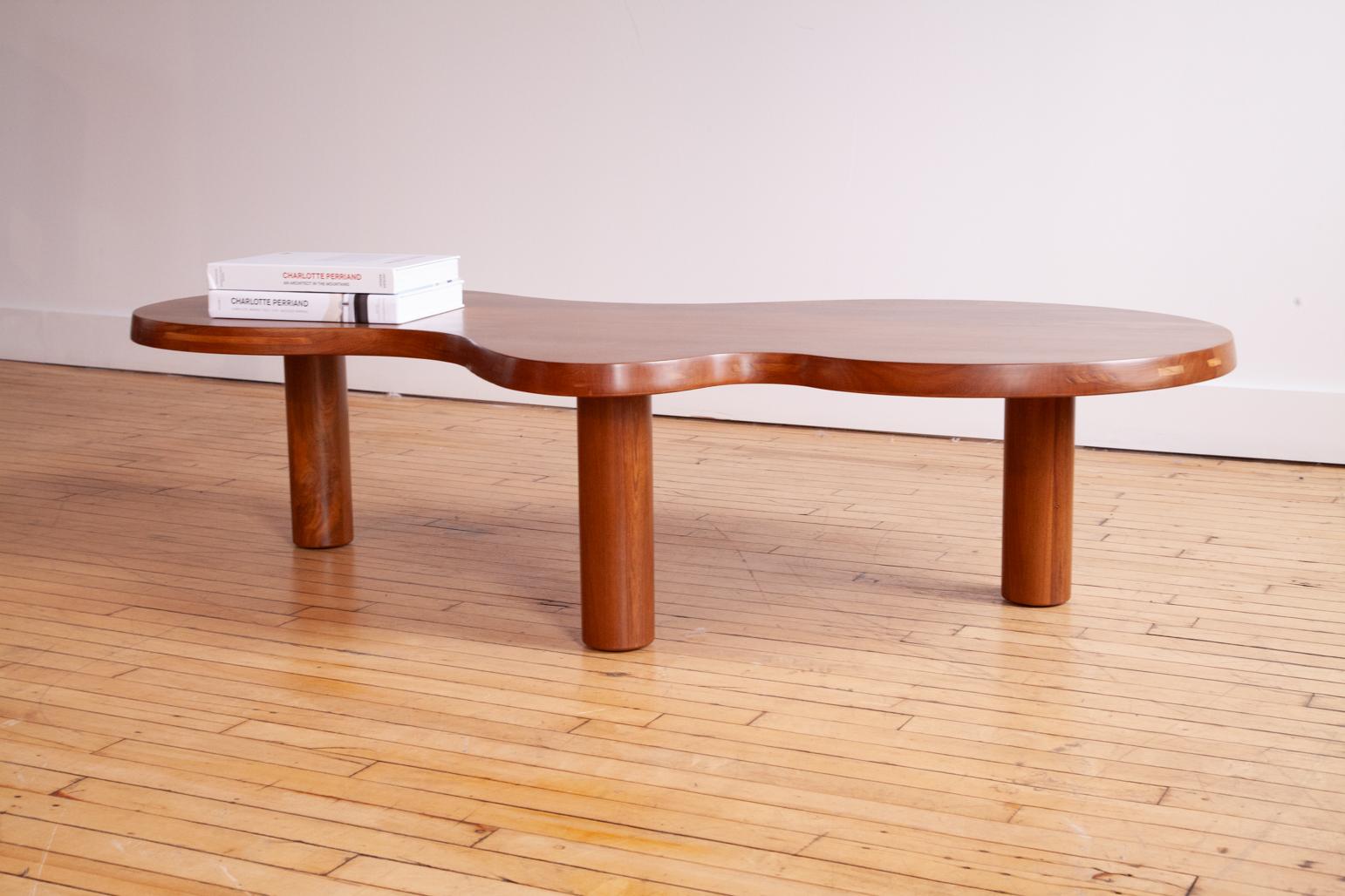 This was a special commission for a Hamptons mansion.

An absolutely stunning coffee table in the manner of French Modern Designs masters such as Jean R and Charlotte Perriand. 

Elegant curves and balanced proportions with very expressive teak wood