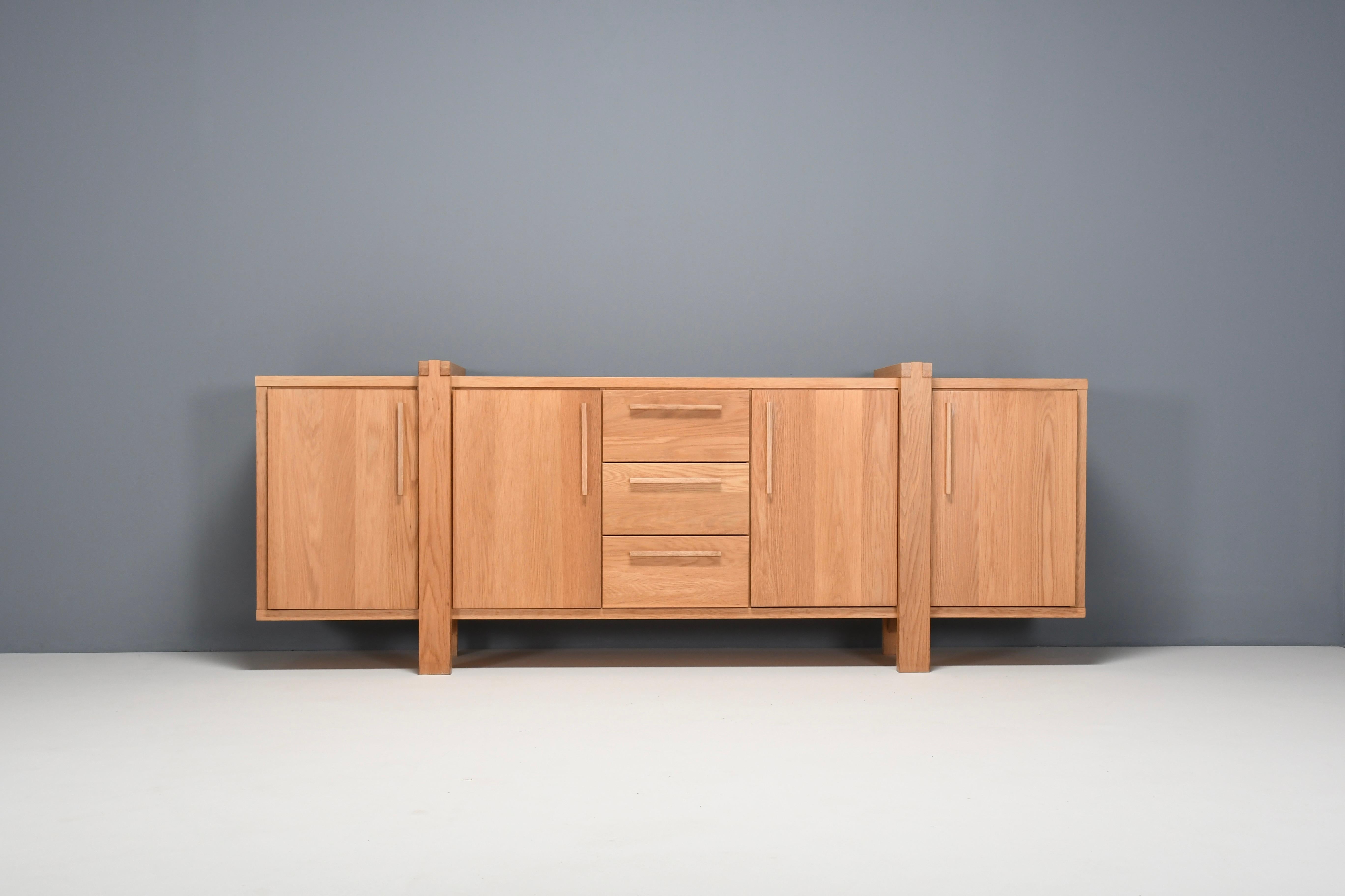 Beautifully crafted Belgian Sideboard in very good condition.

This credenza combines a simplified layout executed within a complex design, and solid construction details.

It is made in a beautiful light oak which gives the sideboard a natural