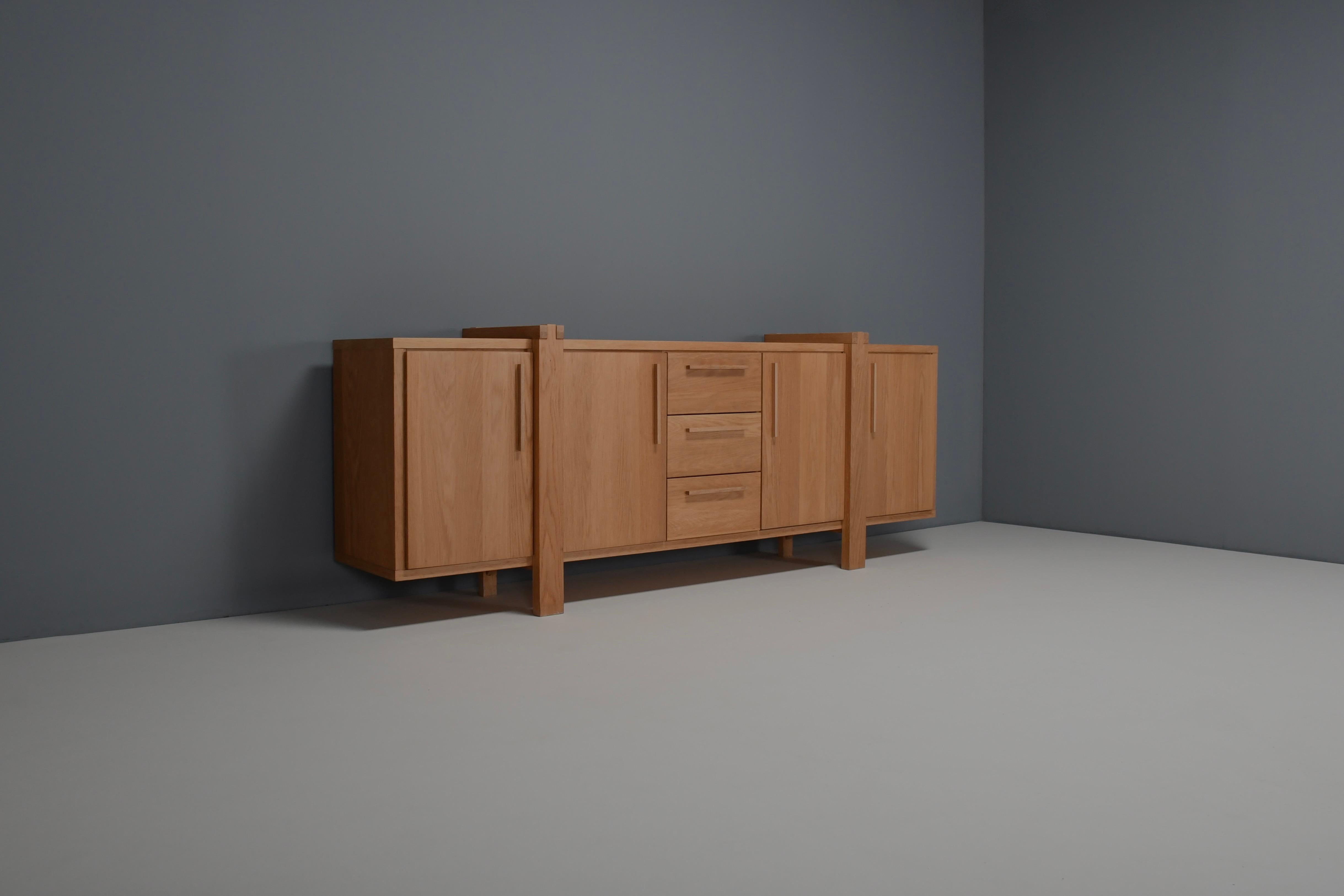 Beautifully crafted Belgian Sideboard in very good condition.

This credenza combines a simplified layout executed within a complex design, and solid construction details.

It is made in a beautiful light oak which gives the sideboard a natural