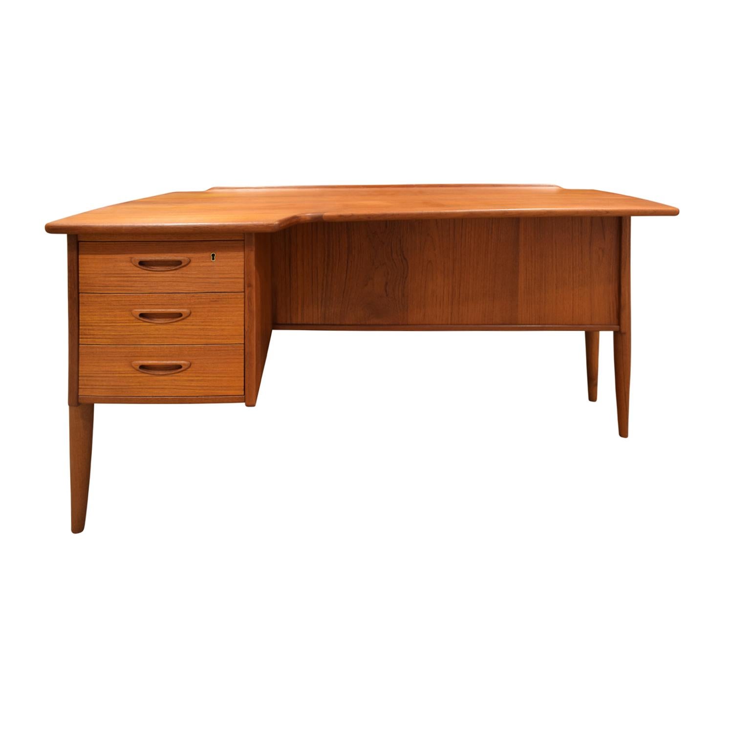 Desk model A10 in teak with drawers on left and partner compartment on other side by Göran Strand for Lelångs Möbelfabrik, Sweden 1960’s. This desk is beautifully made. Shown with Danish chair sold separately.
