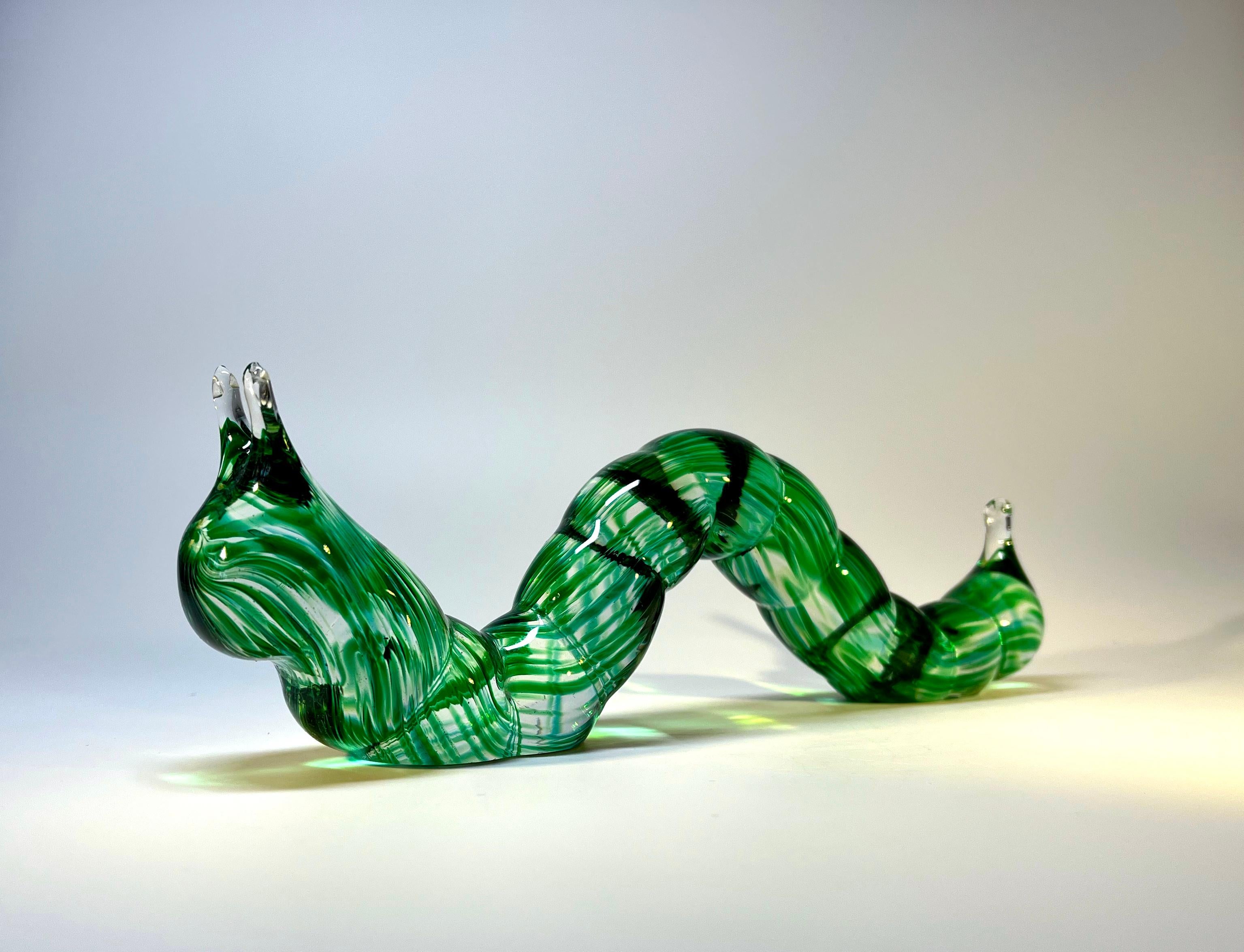 Eye catching large Murano glass Inchworm Caterpillar 
Bright green marl throughout, a fun piece of vintage Murano
Circa 1970's
Height 3.25 inch,  Width 1.5 inch, Length 9.5 inch
Very good condition. Minor surface wear to base
Wear consistent with
