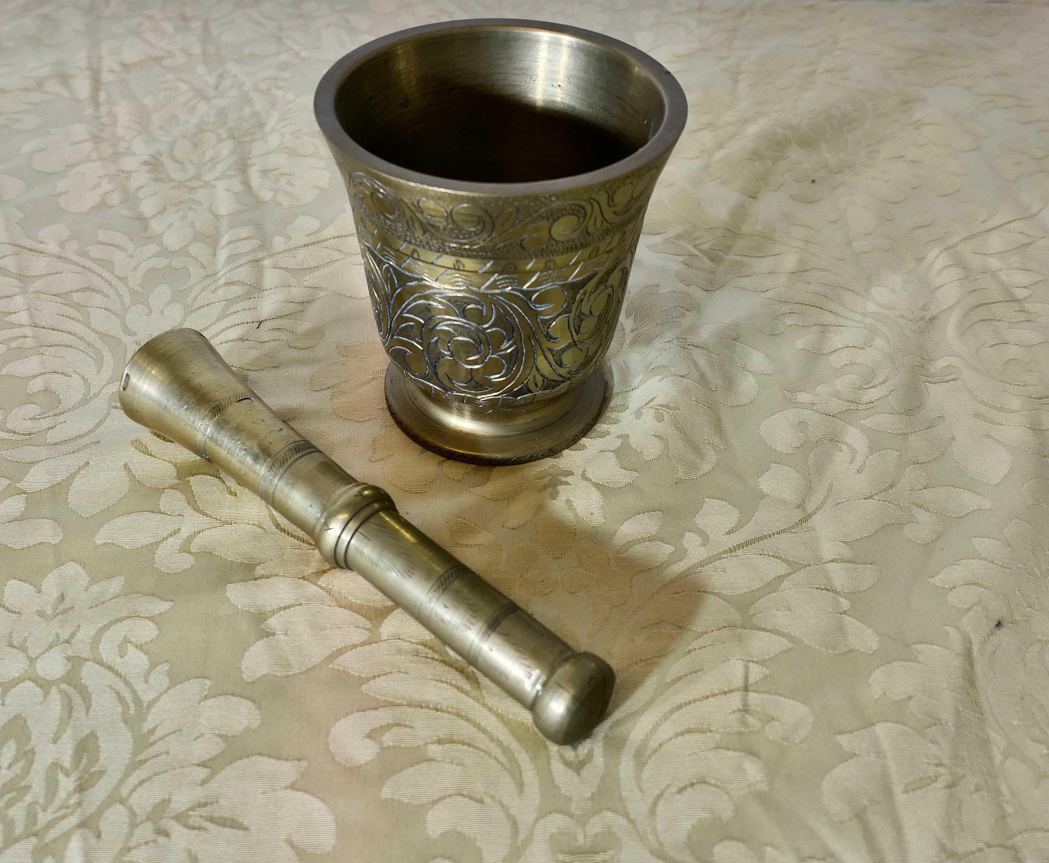 Beautifully Decorated Brass Pestle and Mortar 

A very attractive and heavy quality piece made for the preparation of herbs and spices, the mortar is in very clean condition and well looked after, the mortar is decorated with stylised flowers and