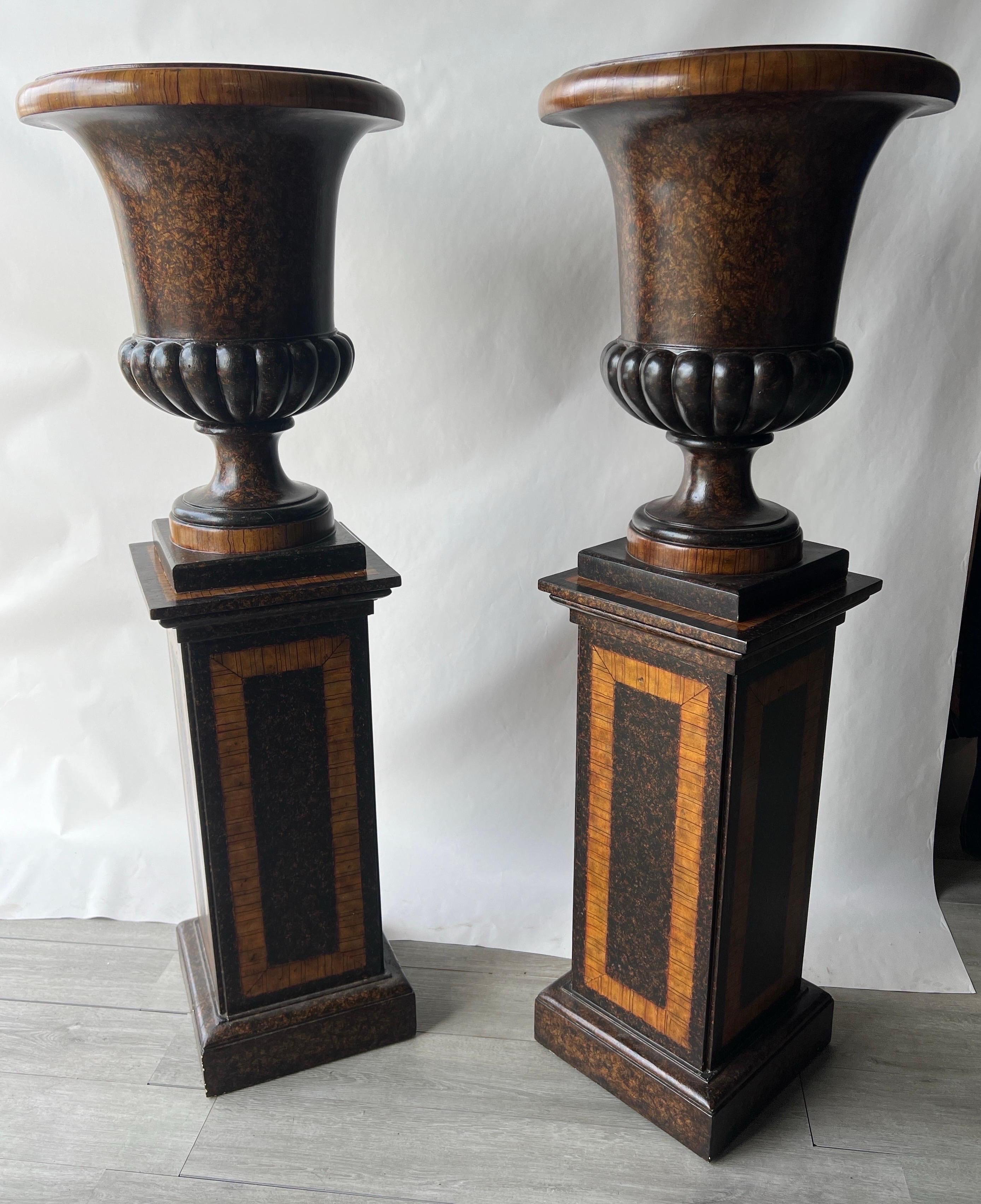 Beautifully decorated pair of faux tortoiseshell interior urns. Fabulously painted urns and pedestals- could be used together or separate as the pedestals are entirely painted  as well. Please look at the close ups of the decoration- as good as it