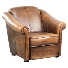 Beautifully designed and comfortable sheepskin armchair with black piping