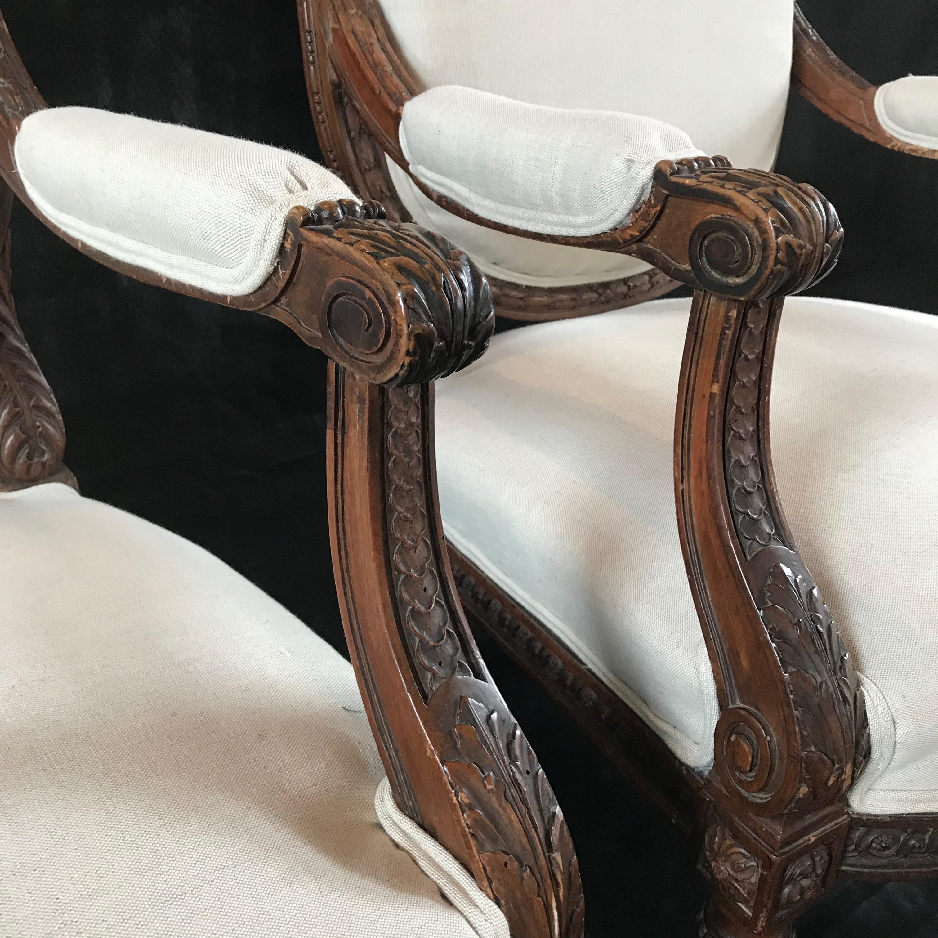 Louis XVI  Beautifully Detailed Pair of French Carved Walnut Armchairs