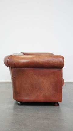 Beautifully finished spacious 3-seater sofa, cognac-colored cowhide leather
