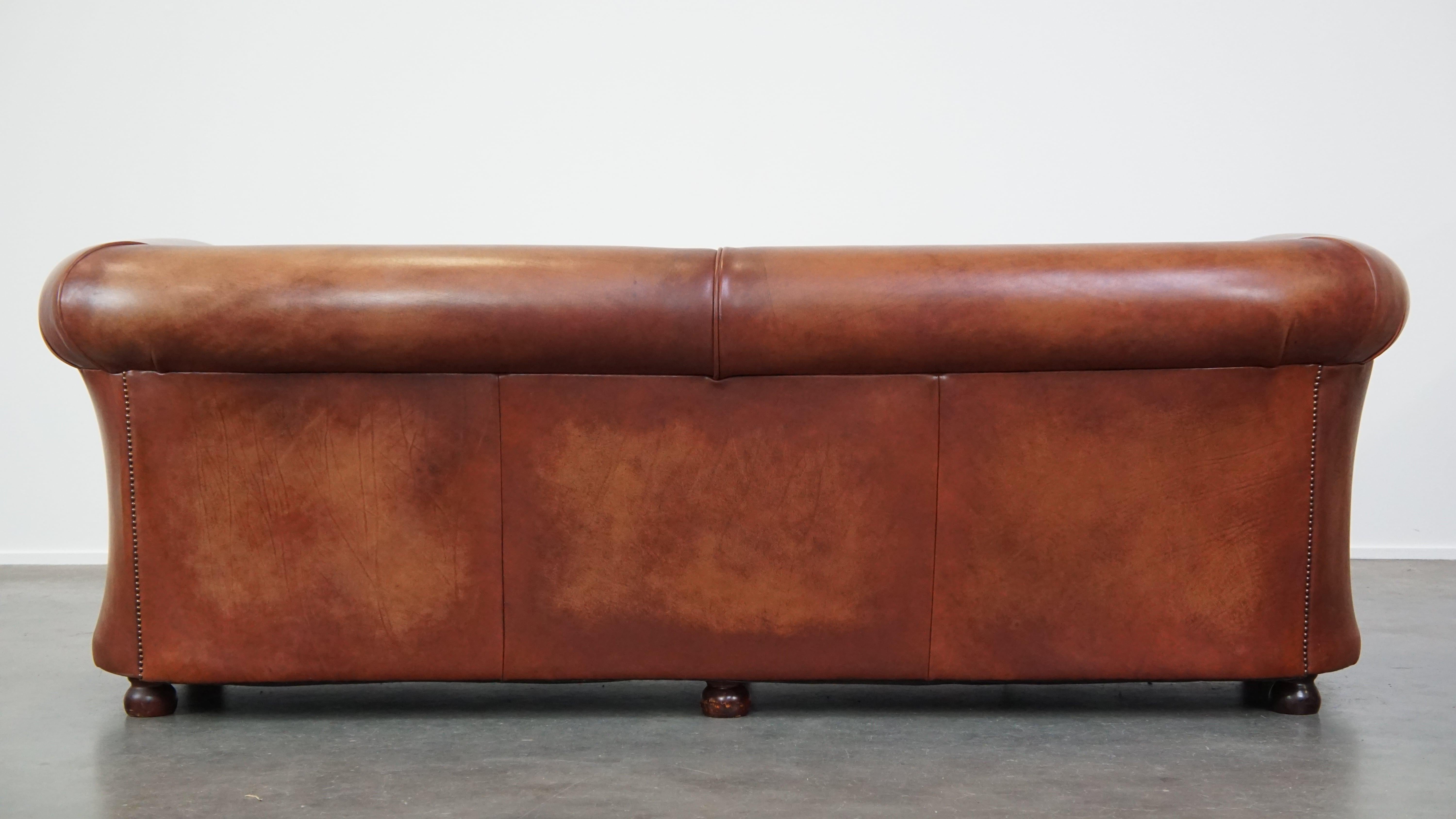 Hand-Carved Beautifully finished spacious 3-seater sofa, cognac-colored cowhide leather