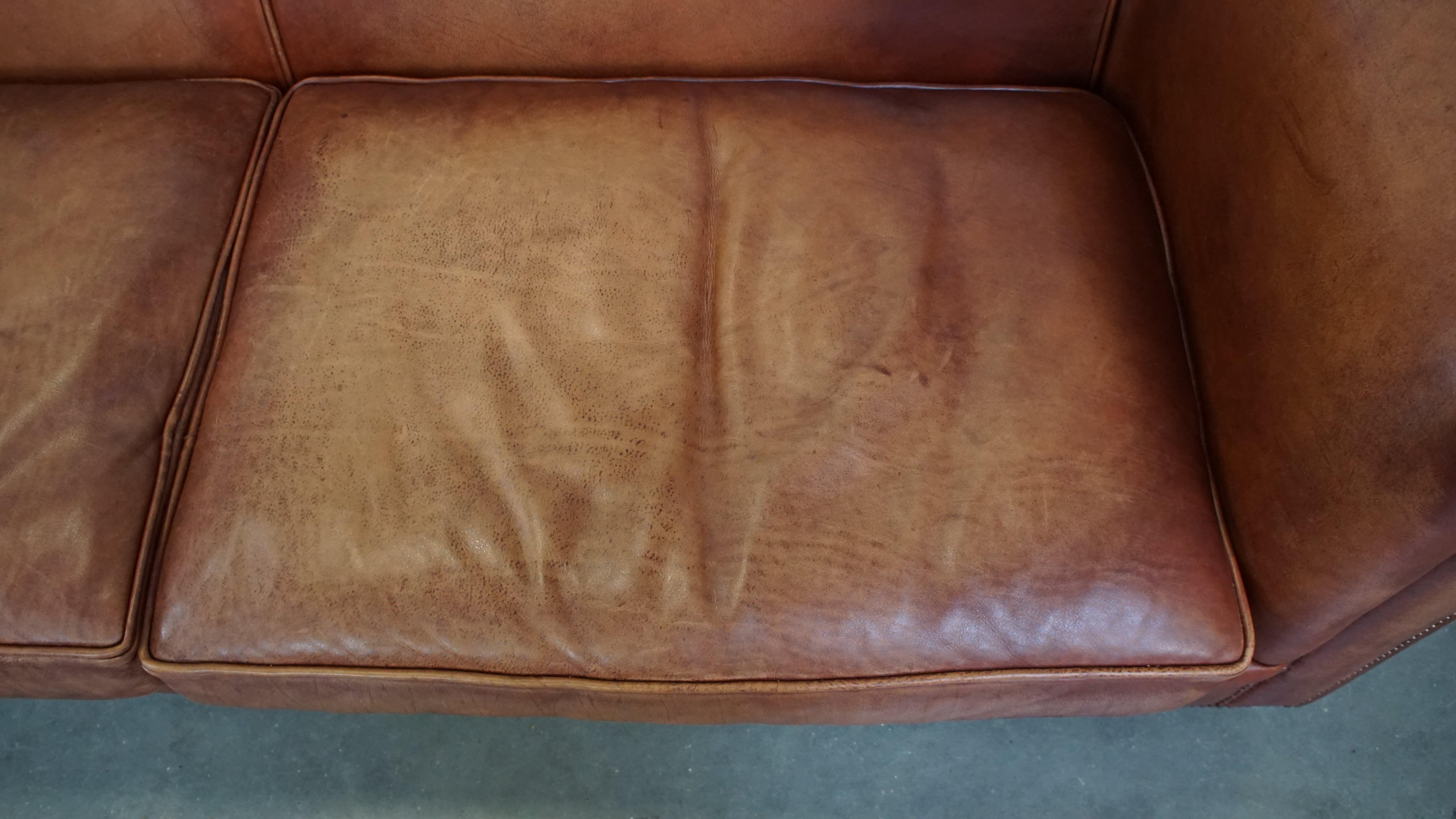 Cowhide Beautifully finished spacious 3-seater sofa, cognac-colored cowhide leather