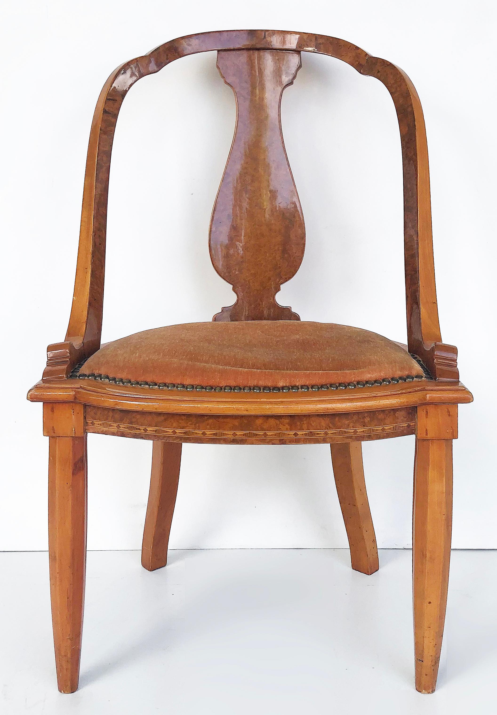 1920s Grained and Fine Austrian Biedermeier Burlwood Table and 2 Chairs.

Offered for sale is a 3-piece set of Austrian Biedermeier burlwood furniture. The centerpiece of the set is a square Burlwood table with four legs rising from the center of