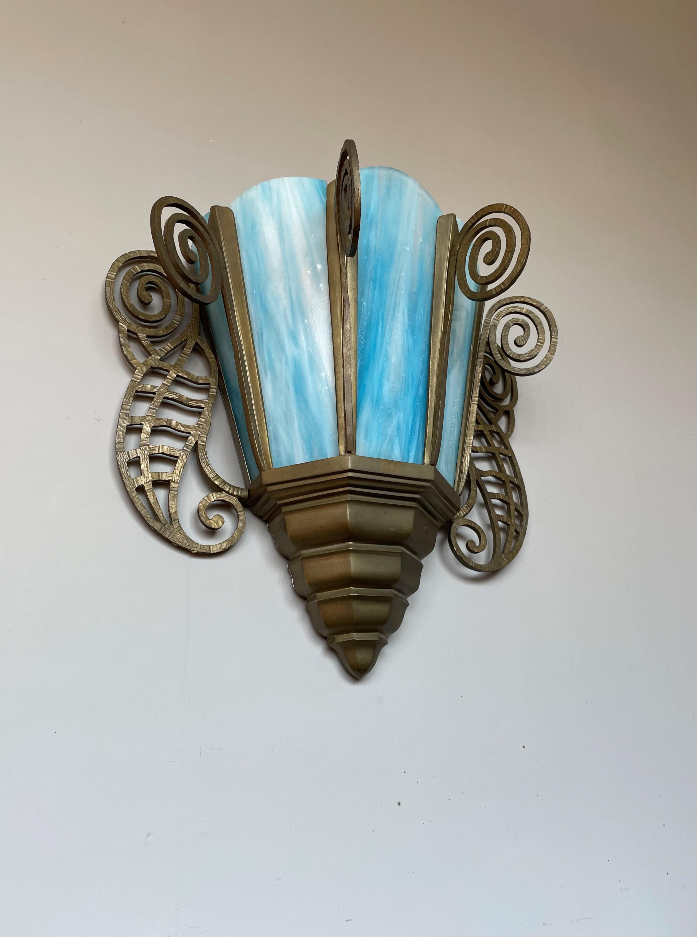 Wonderfully stylish and aesthetically pleasing sconce, easy to wall mount.

This handcrafted, semi antique sconce for many reasons is a joy to own and look at. Hand-crafted pieces always have an extra quality to them and we believe it is because of