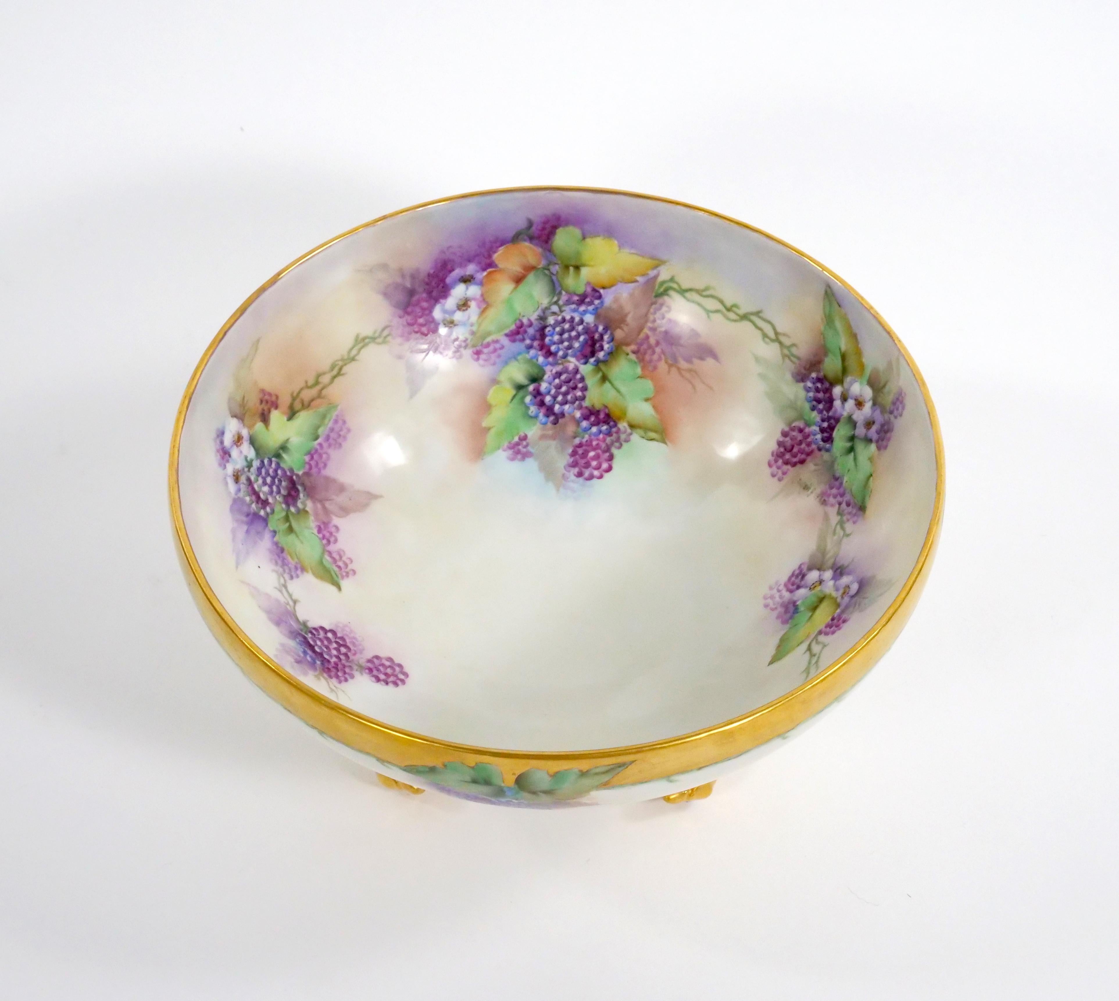 Enhance your dining or decor with this beautifully hand-painted and gilt gold-decorated French Limoges Porcelain Footed Tableware Centerpiece  / punch Bowl. This exquisite piece is a true work of art that radiates elegance and charm. The centerpiece