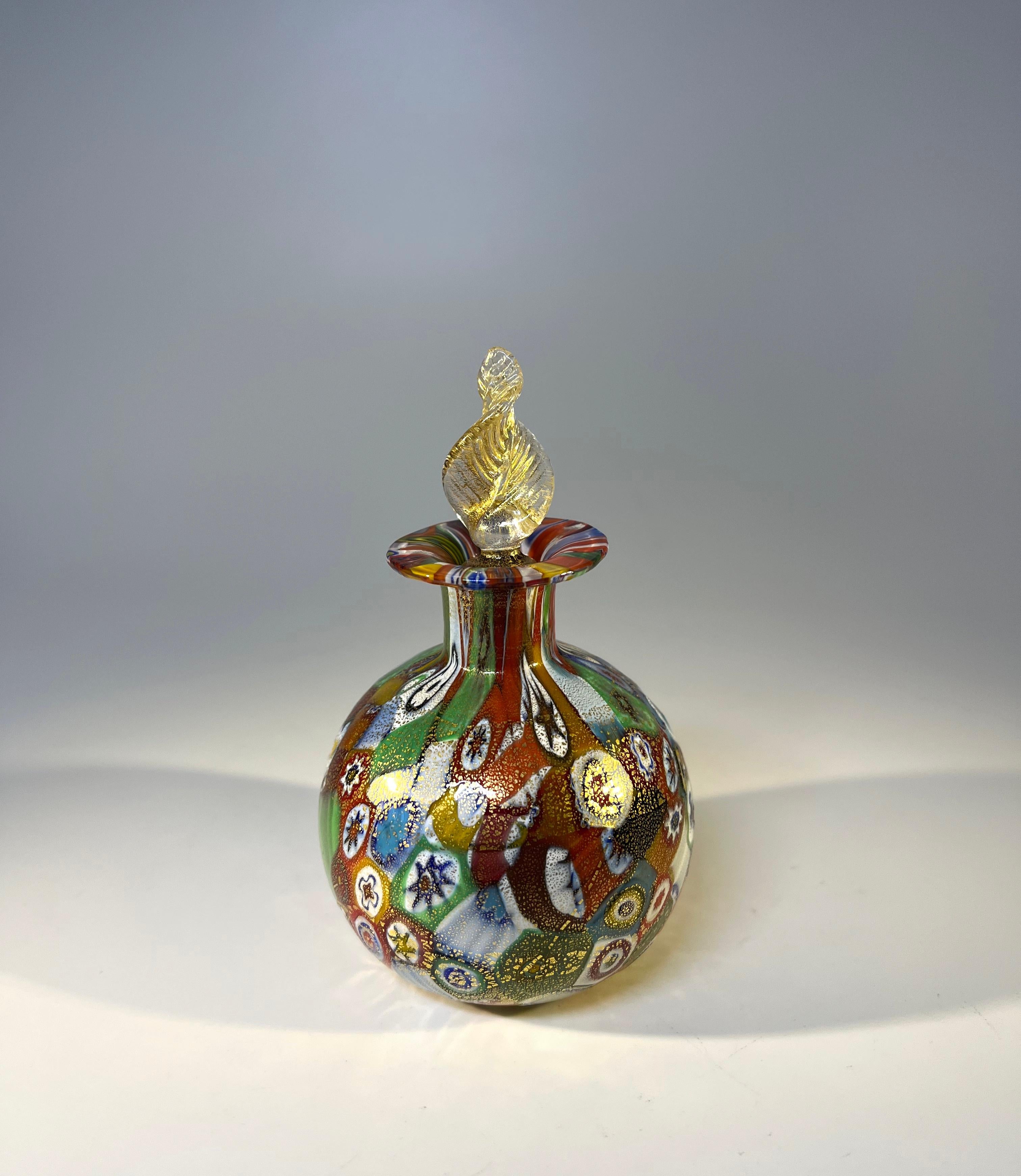 Superb Venetian millefiori glass perfume bottle with stopper, attributed to Fratelli Toso.
Millefiori is created using the incredible technique of cut, tiny rods of coloured glass known as Murrine.
Circa 1980's.
Measures: height 4 inch, diameter