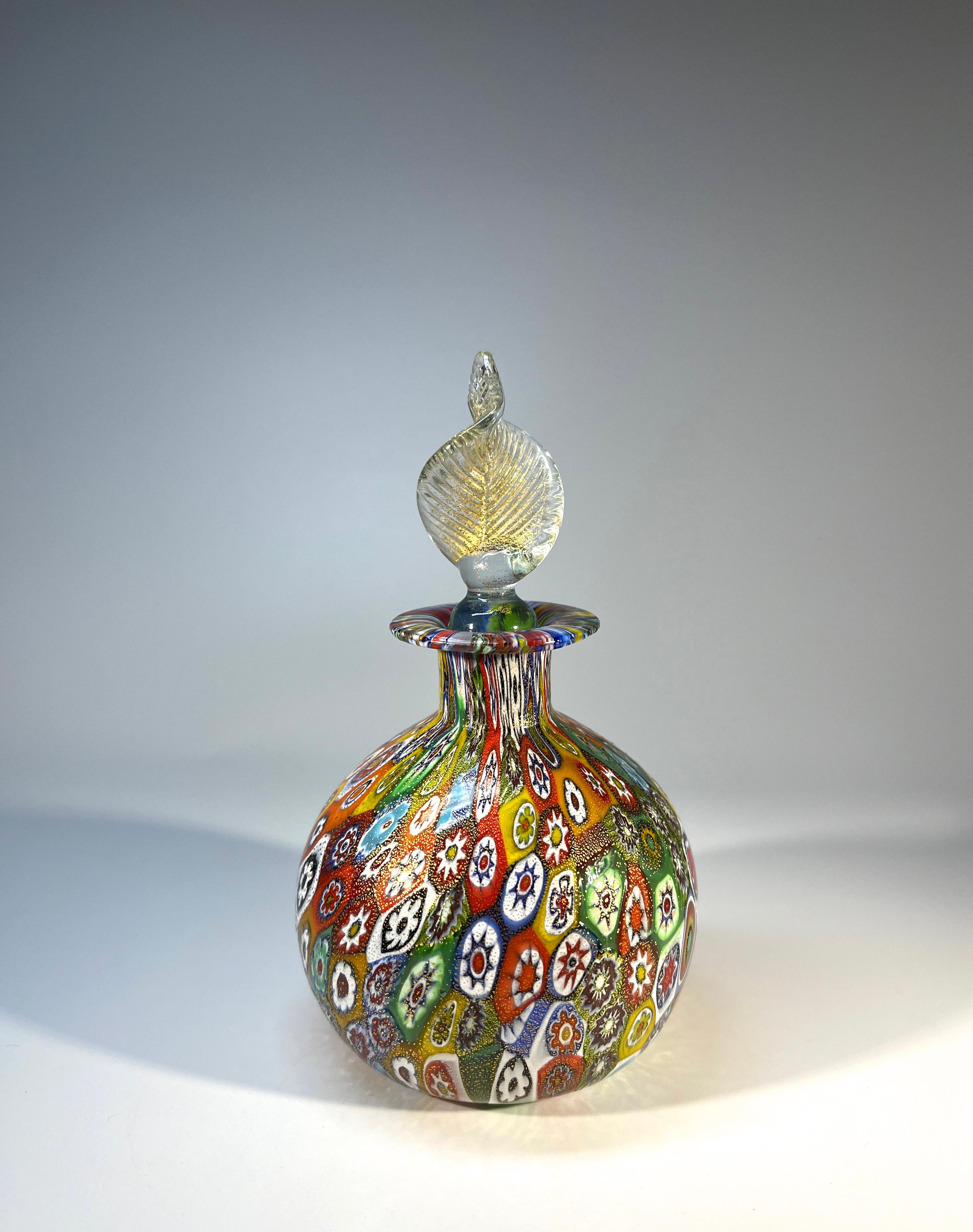 Stunning and incredibly intricate, Venetian Millefiori glass perfume bottle decorated with gold Aventurine detail
Created by Murano master-craftsmen,  Millefiori is created using the technique of cutting tiny rods of coloured glass known as Murrine 