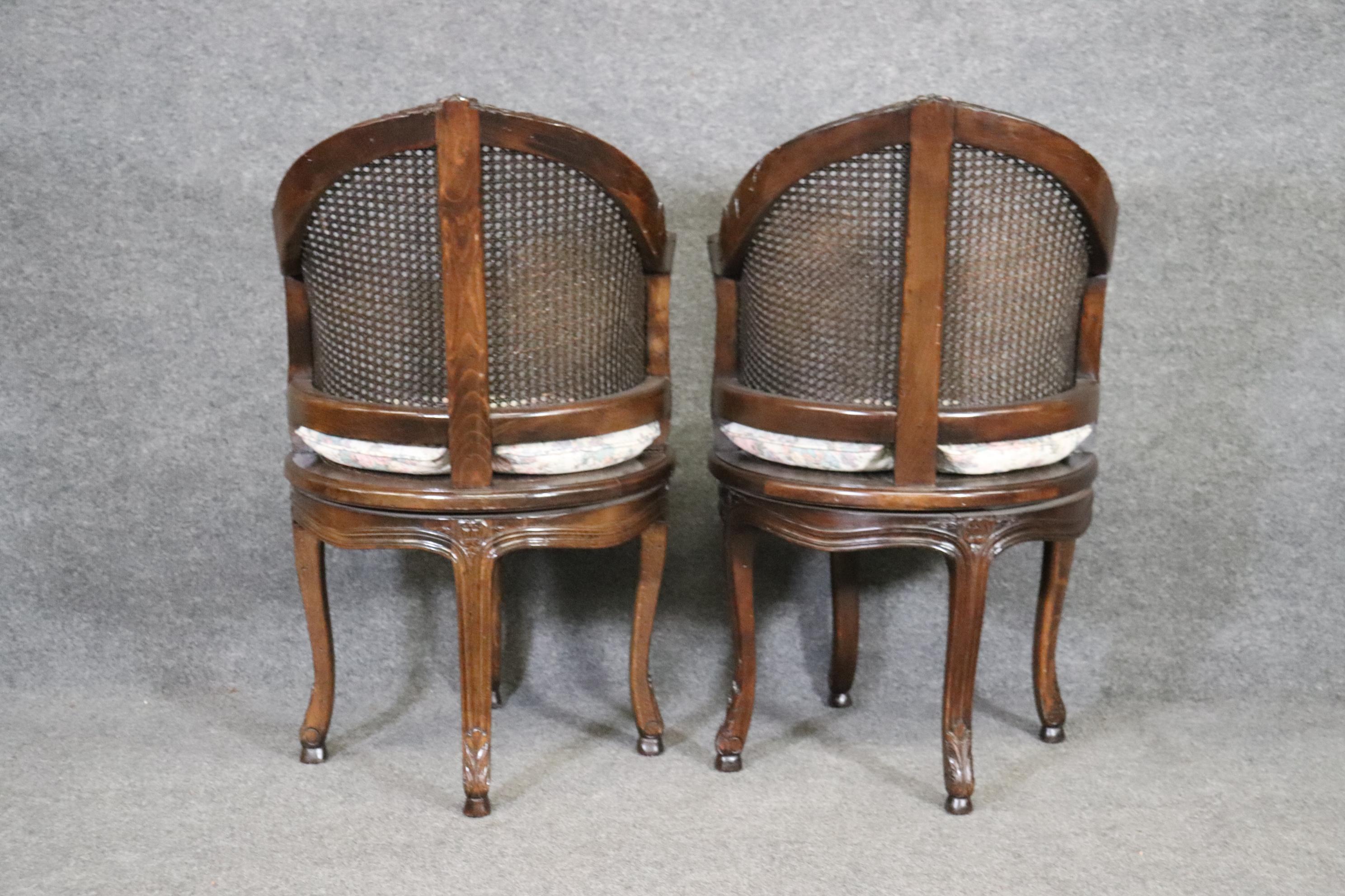 Beautifully Pair of Dark Walnut Cane back and Seated Swiveling Corner Chairs In Good Condition In Swedesboro, NJ