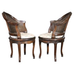 Vintage Beautifully Pair of Dark Walnut Cane back and Seated Swiveling Corner Chairs