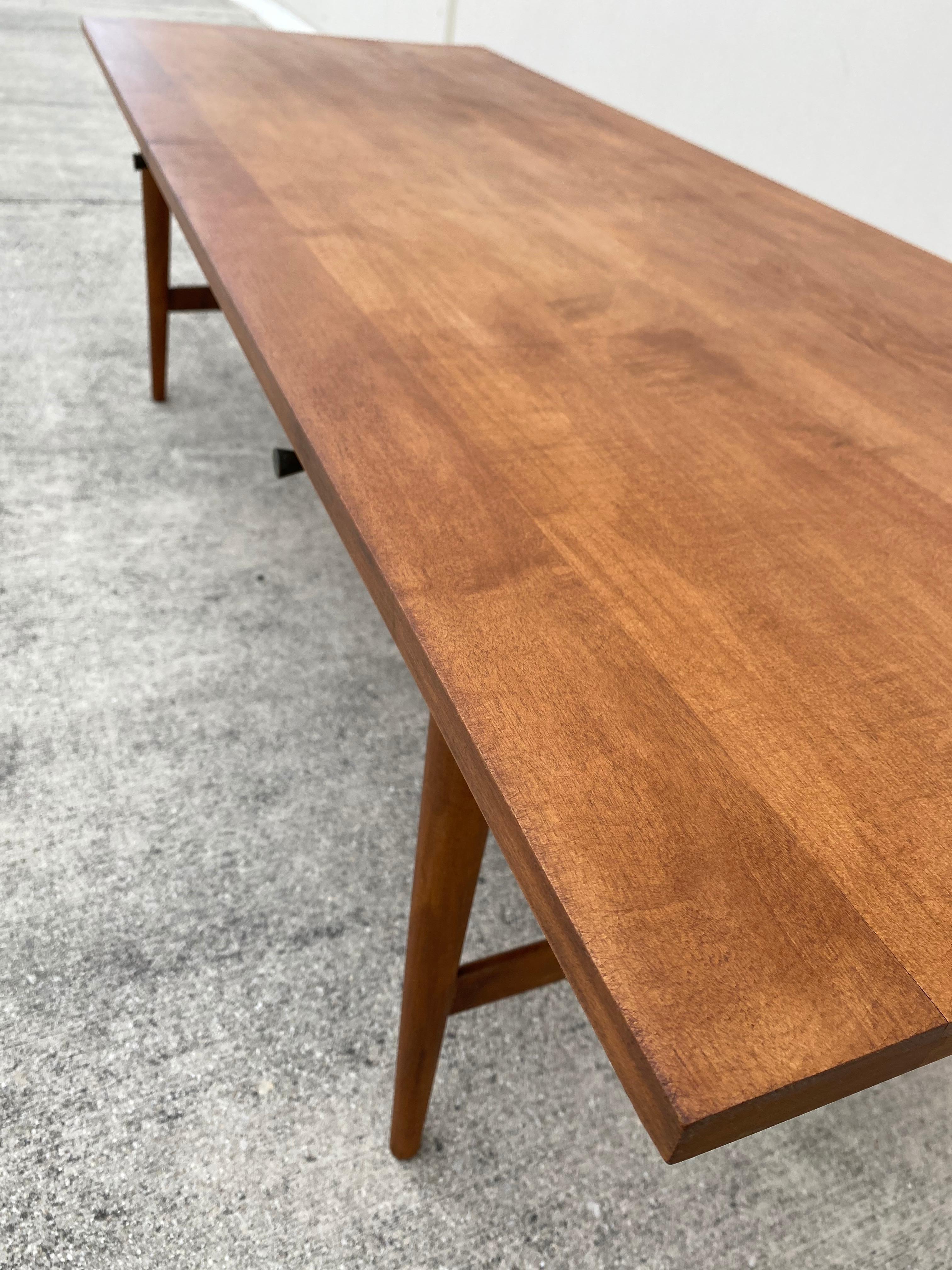 Beautiful solid wood coffee table. From the Planner Group line designed by Paul McCobb for Winchendon Furniture Company. Retains original manufacturer’s label and guaranteed authentic. Simple and elegant lines with original pulls and refinished