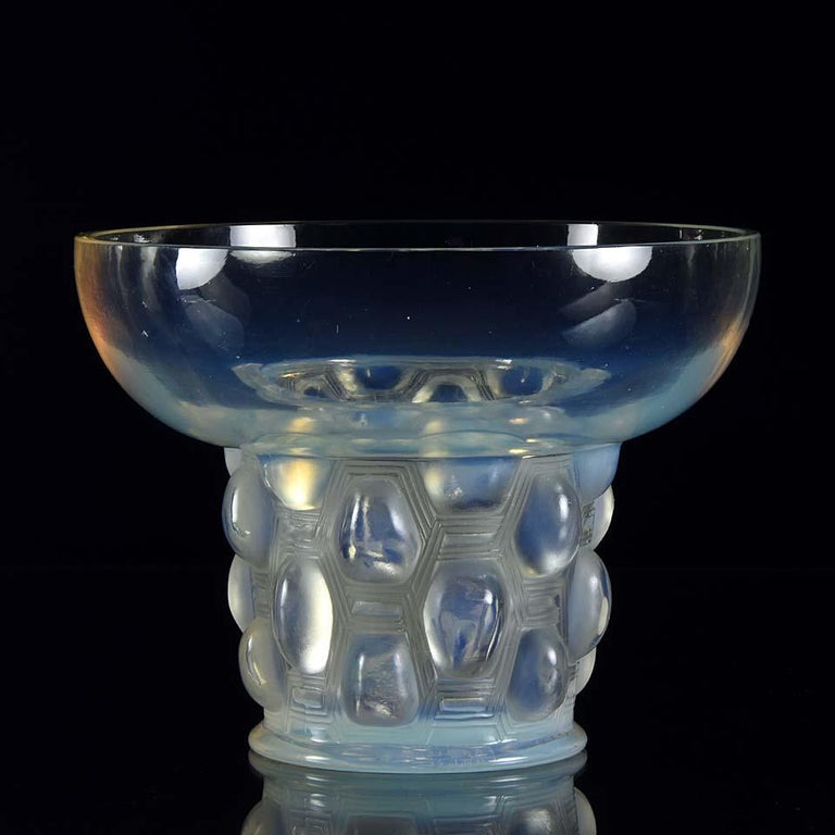 A very striking clear, frosted and opalescent Art Deco glass vase of trumpet form with raised cabochons, exhibiting excellent sky blue colour and fine detail, signed R.Lalique France

Beautreillis
Catalogue number: 989
Signature Identification: