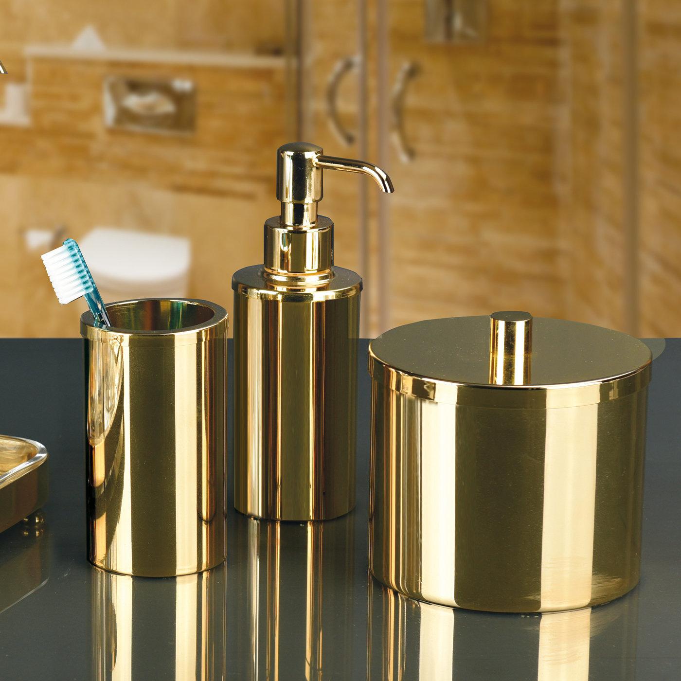 This bathroom set is comprised of a toothbrush holder, a soap dispenser, and a cotton box entirely handcrafted of brass, finished with precious 24k gold. An opulent accent to any modern or classic bathroom, it combines traditional craftsmanship with