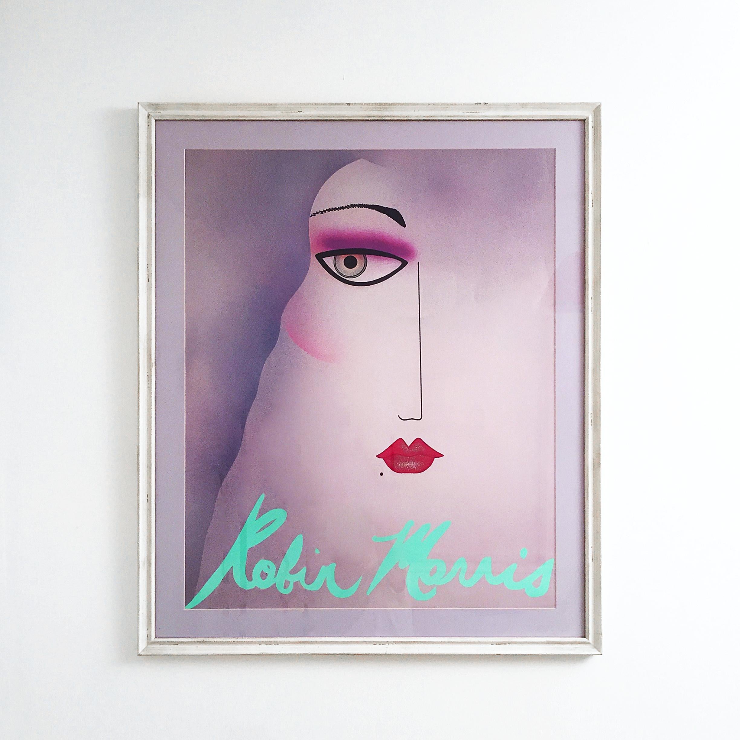 A beautiful 1980s poster by Robin Morris representing a woman's half face in Art Deco style and pastel colours. Mounted in pastel purple and framed in white distressed frame.
For an accurate international delivery quote please message us. 
