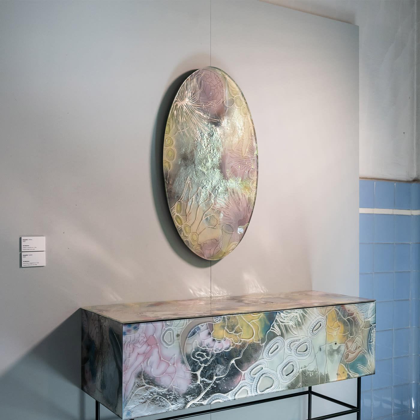 Beauty Mirror, a piece of the Acquatic collection, is the result of an investigation of the relationship between different organic lives.This mirror, designed by Tal Waldman, is the playground in which human organism and nature connect and become