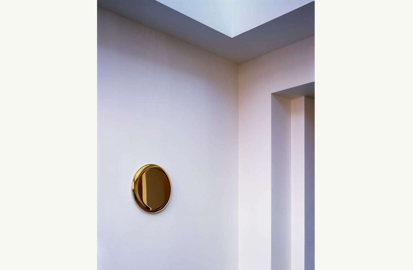 Handmade, the Beauty mirror in Polished Brass is a special jwel to hang on your wall. Warmly reflective, the Beauty mirror is honest to its material which is integral to the work of artist Michael Anastassiades.
  