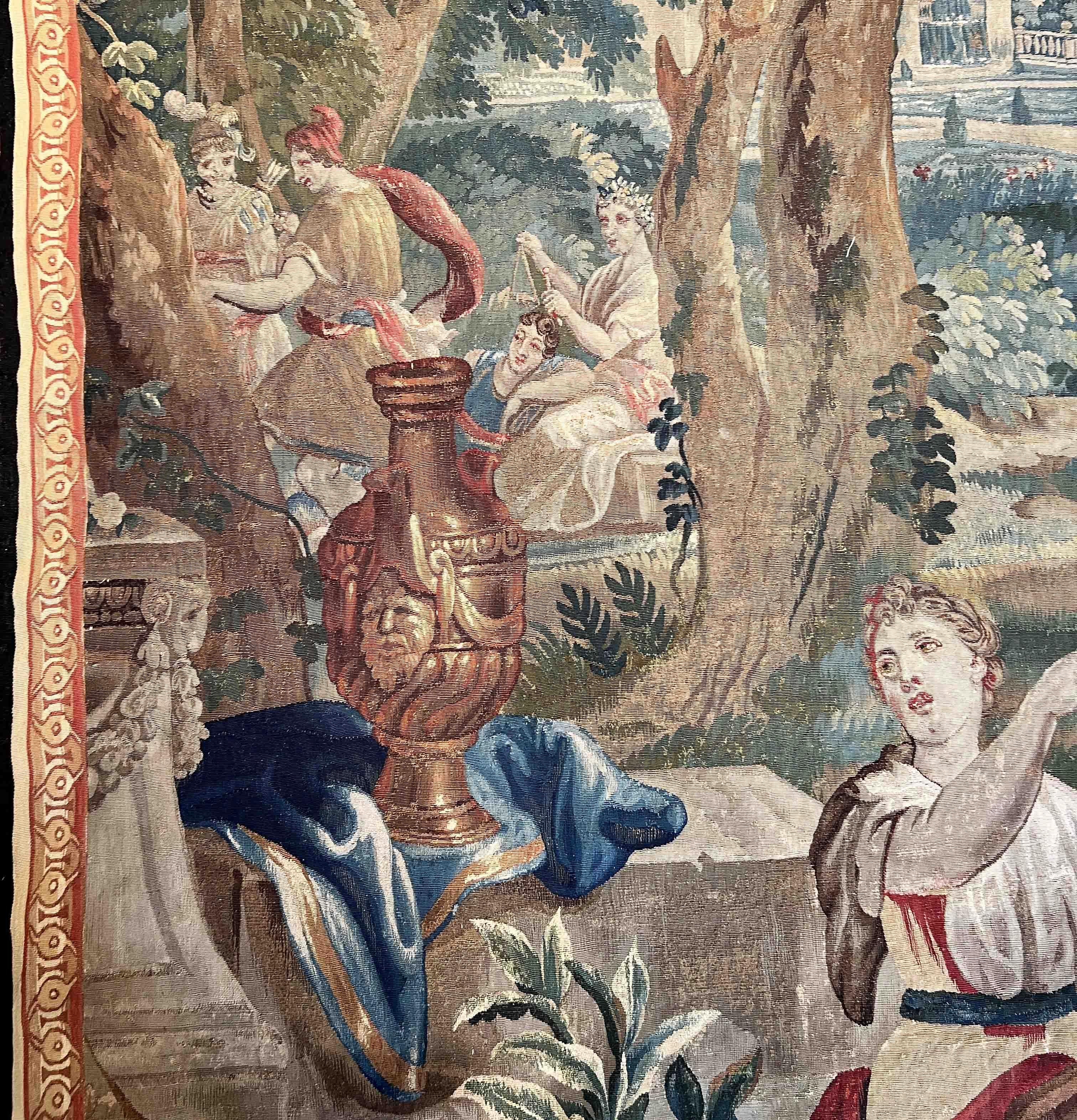 Exceptional tapestry from the 18th century Royal Manufacture of Beauvais.
Representation of a woman wearing a crown of wheat around her head and playing the Tam-tam in the garden of a castle, probably that of Versailles, harming her servants.
