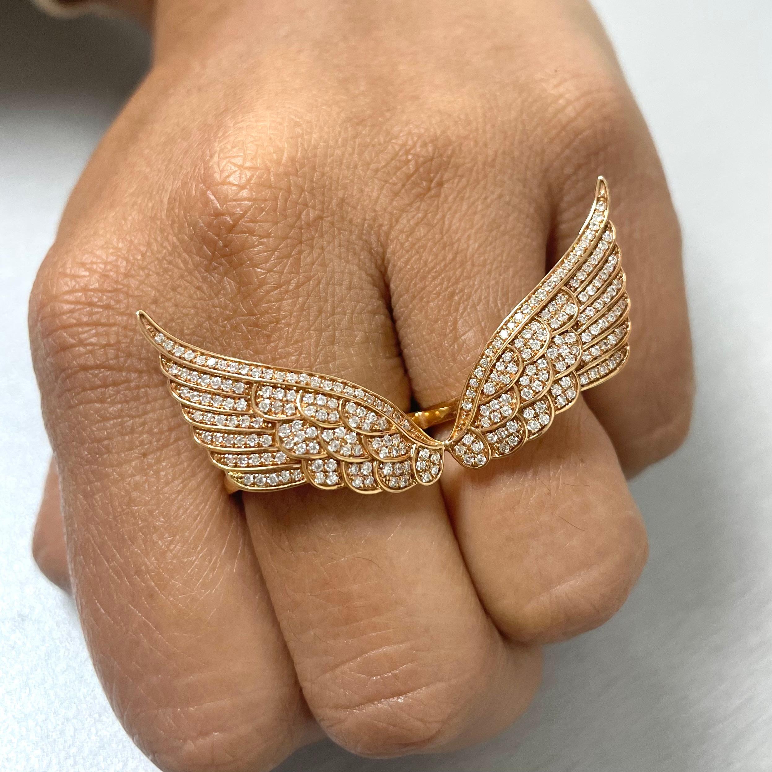 The Diamond and Rose Gold Wings Ring is a cool and funky expression of style and playfulness.

Diamonds Shape: Round
Diamonds Weight: 0.86 ct 
Diamond Color: G - H
Diamond Clarity: VS - SI (Very Slightly Included - Slightly Included) 

Metal: 18K