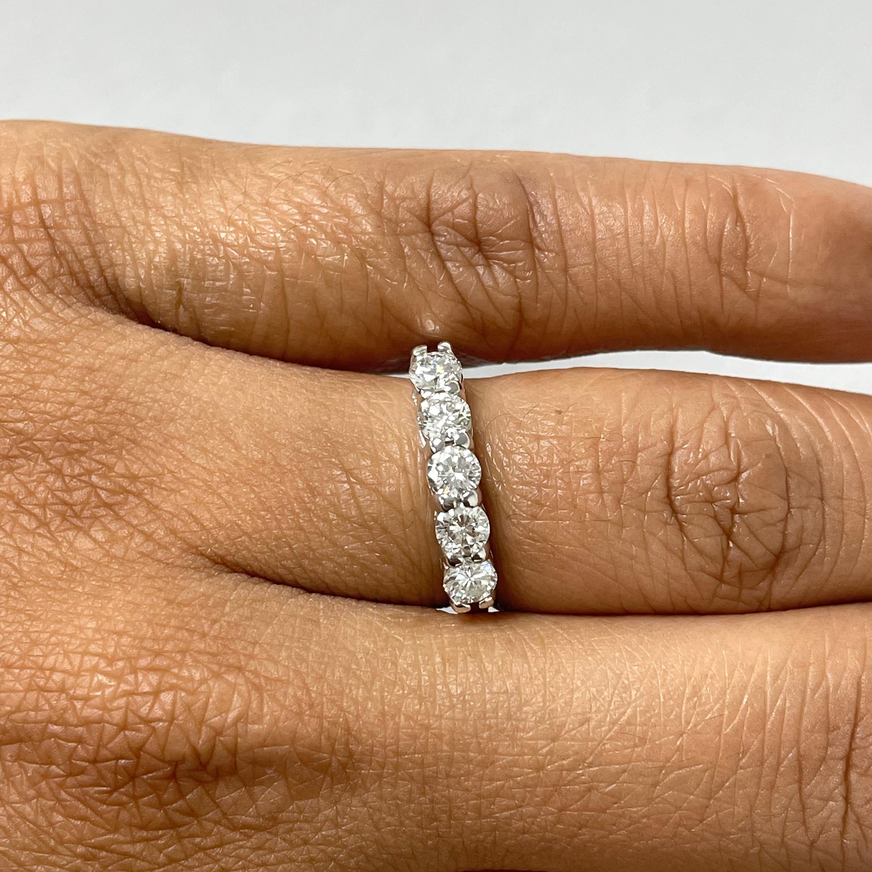 The 5 Diamond Band is a simple and classic style that compliments and enhances any traditional engagement ring, yet also makes a statement worn independently. 

Diamond Shape: Round 
Total Diamond Weight: 0.85 ct
No. of Diamonds: 5
Diamond Color: H