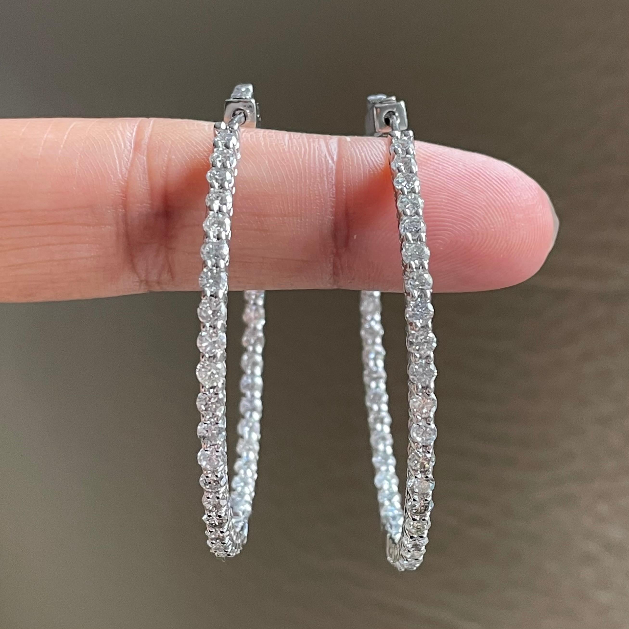 Chic and suave, diamond hoop earrings are forever stylish and fun. 

Diamond Shape: Round 
Total Diamond Weight: 6.15 ct 
Average Diamond Size: 0.07 ct 
Diamonds Color: H - I 
Diamonds Clarity: SI - I (Slightly Included  - Included) 

Metal: 14K