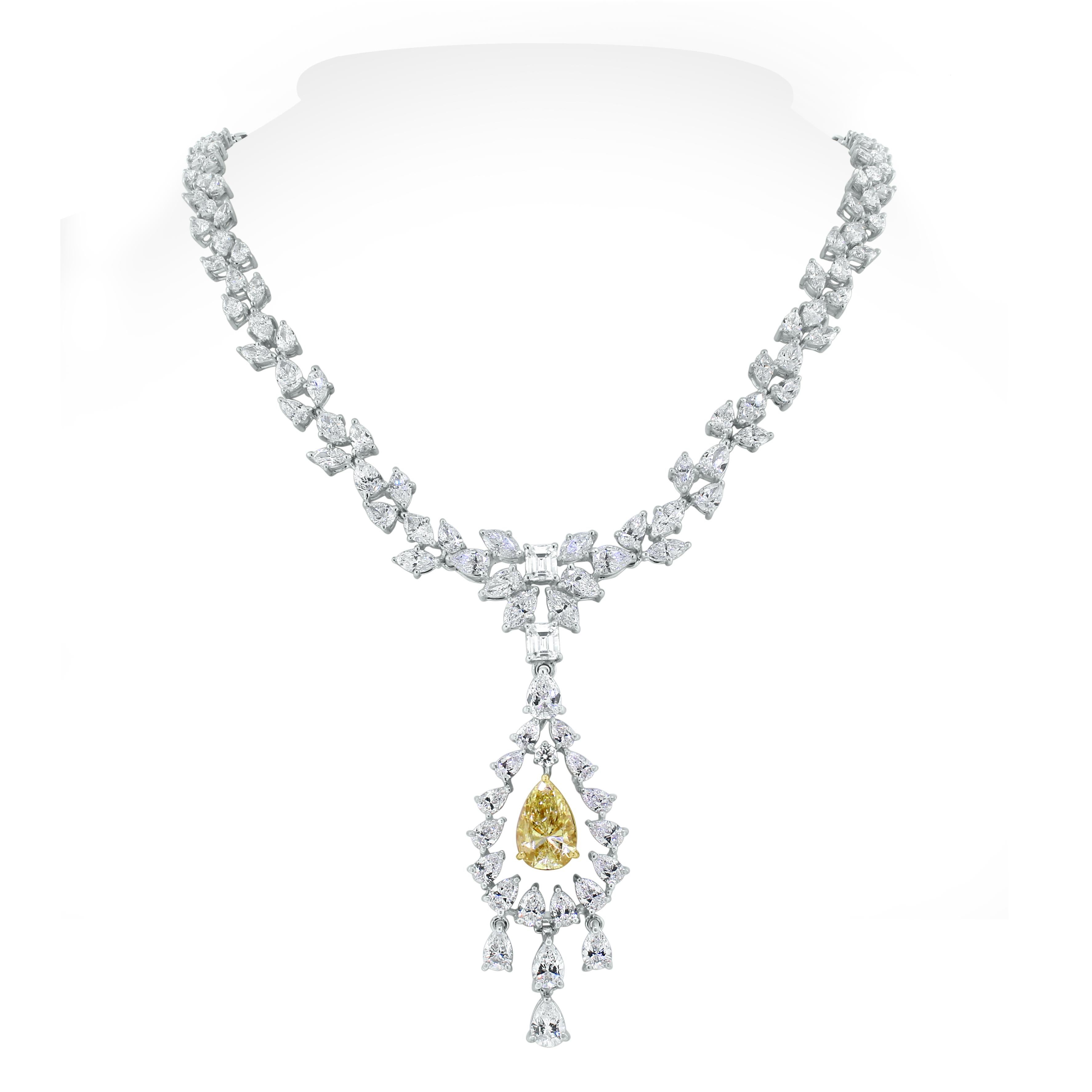 With a yellow pear shape diamond at its center, the Amaya necklace is all about delicacy and oomph. The marquise and pear diamonds weaving around the neck are elegant and sensual. This stunning piece can be worn with or without the pendant to add to