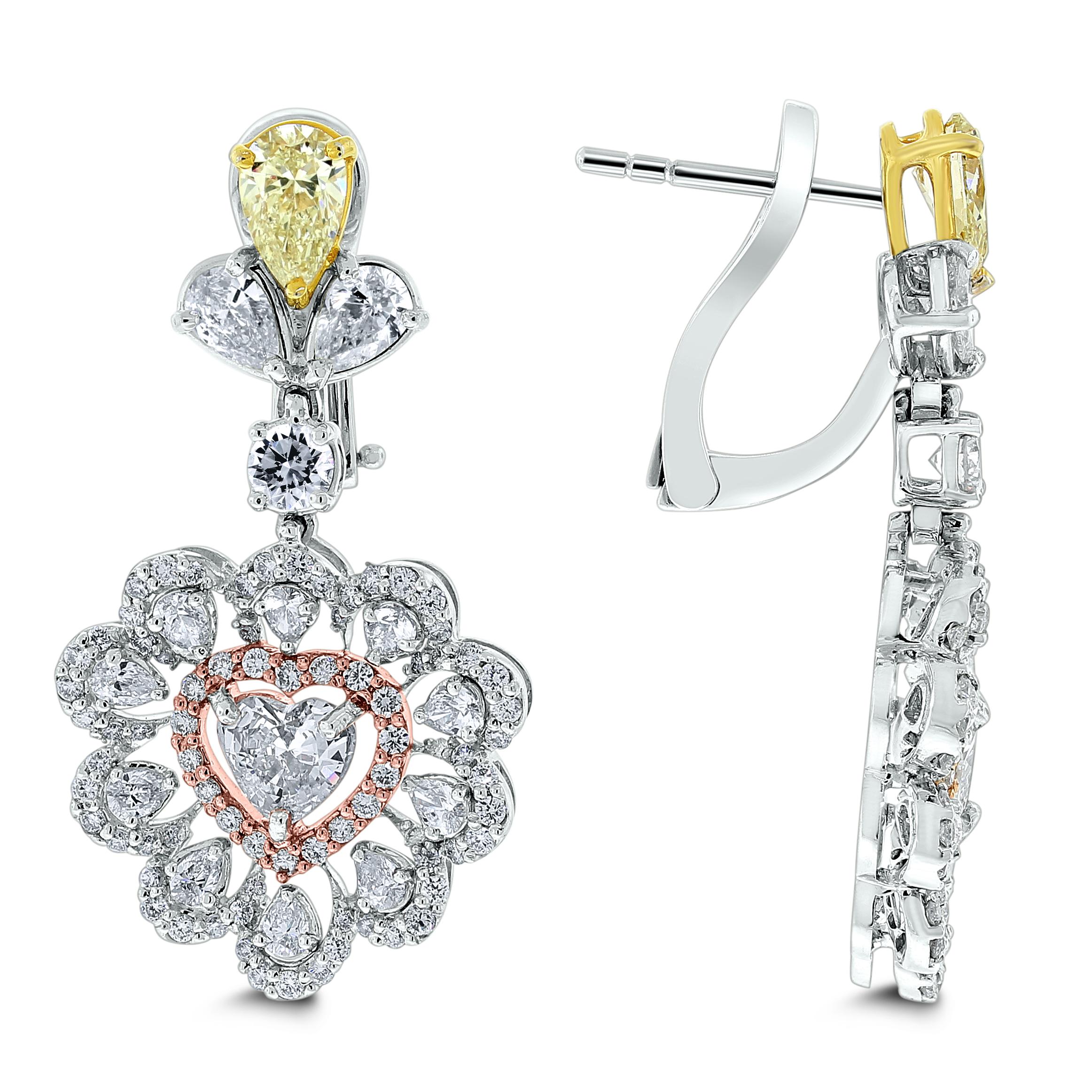 The Beauvince Amore Heart Diamond Earrings celebrate love and joy with their cheerful design and combination of shapes and colors.

Diamonds Shapes: Heart Shape, Pear & Round
Total Diamonds Weight: 5.61 ct
Center Solitaires: Heart Shapes 1.09 ct (2
