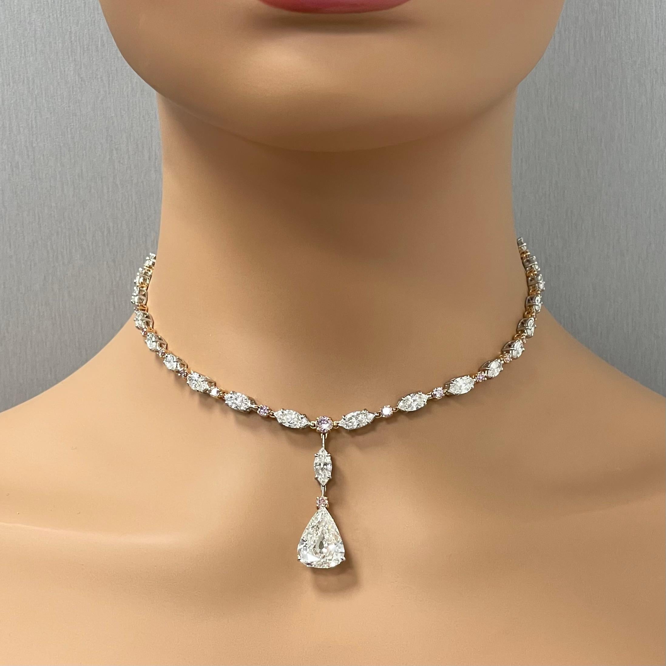 A sensual and dazzling combinations of natural intense pink diamonds with white marquise and pear shapes enables this stunning necklace to create all the drama in its simplicity. The over sized 6.05 ct Pear Shape center takes the neckpiece an extra
