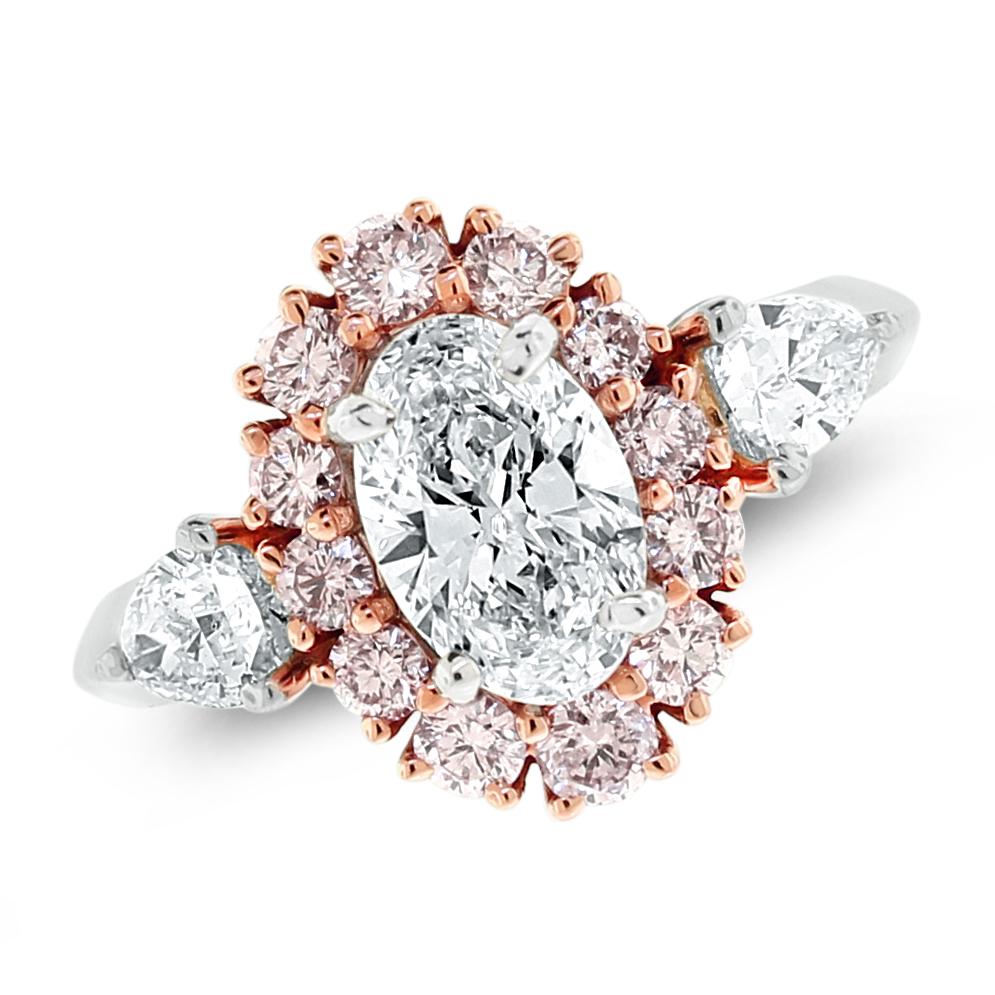 The Ariana Engagement Ring features a G color Internally Flawless Oval diamond surrounded by a pink diamond halo accented with lovely unique pear shape diamonds. It is a beauty unlike another.

Center Diamond Shape: Oval
Center Diamond Weight: 1.08