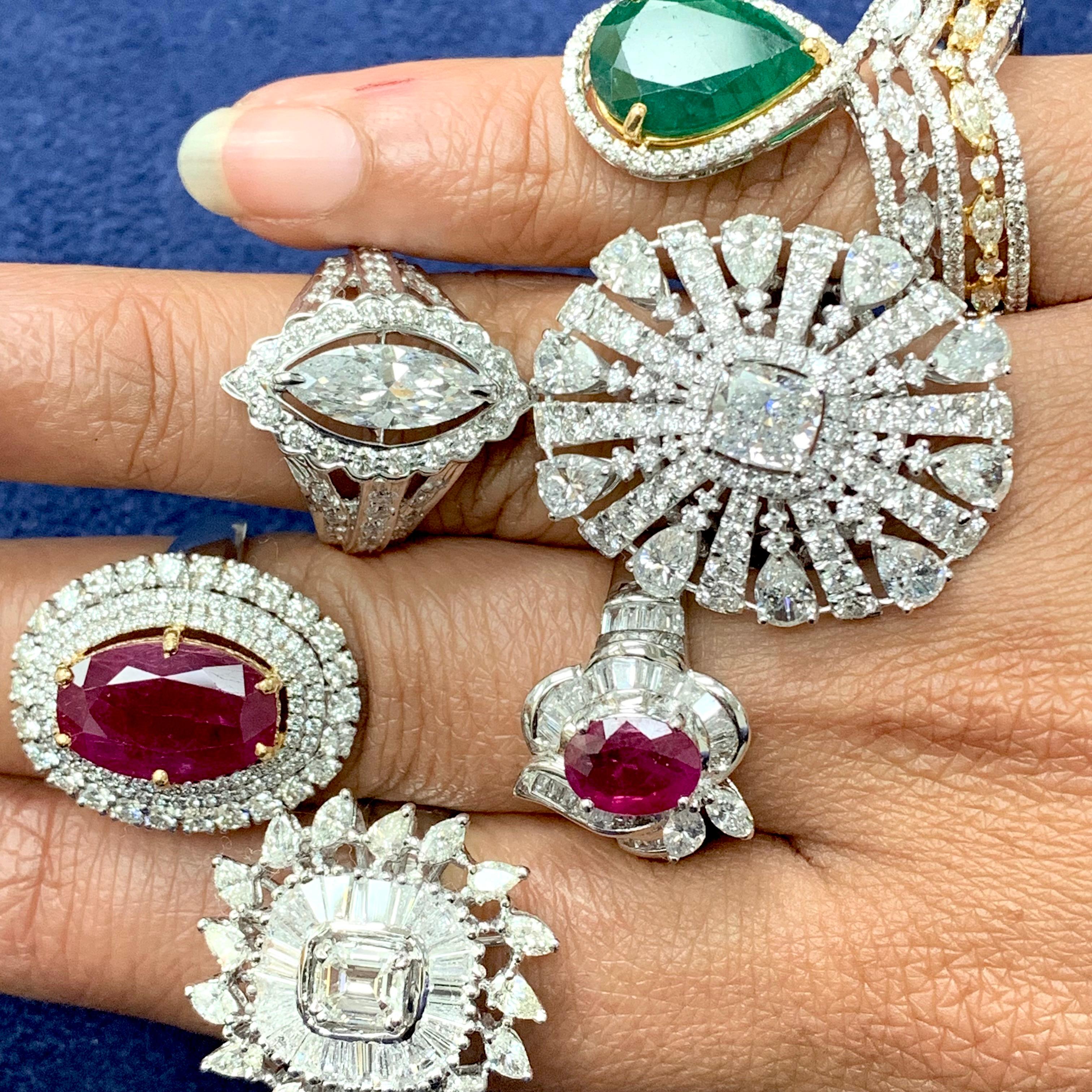 With a unique floral design, the Bailey ring features baguette and marquise diamonds set in a dreamy pattern around a deep red ruby to make its lovely color glow. Dainty and sophisticated, this ring is a work of art with its shapes, colors and